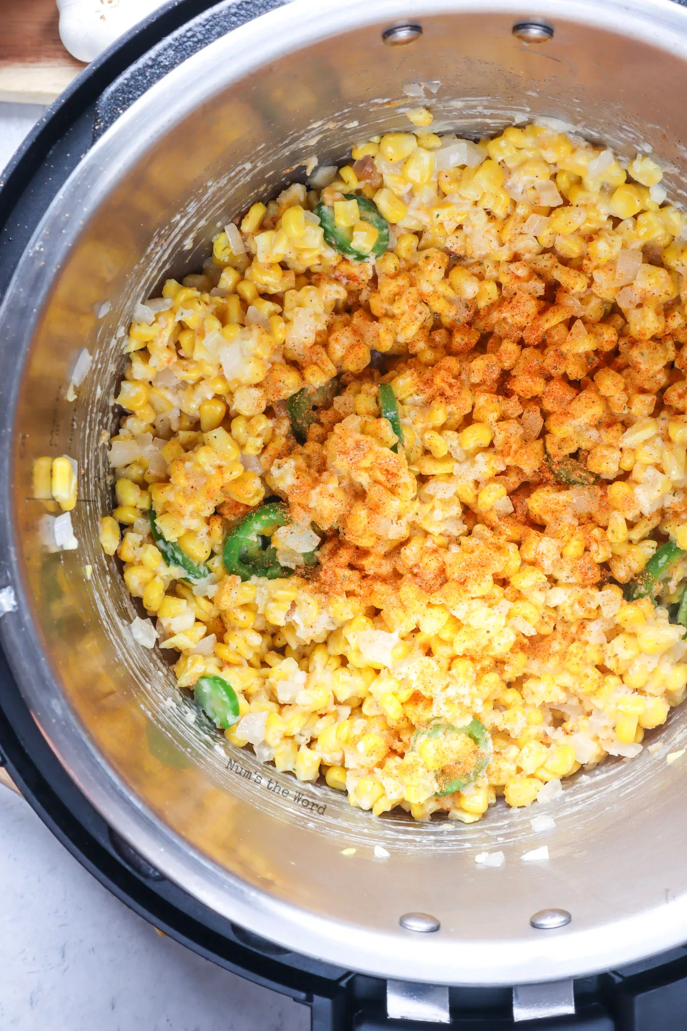 corn, onion, jalapeno and garlic all added to butter in instant pot