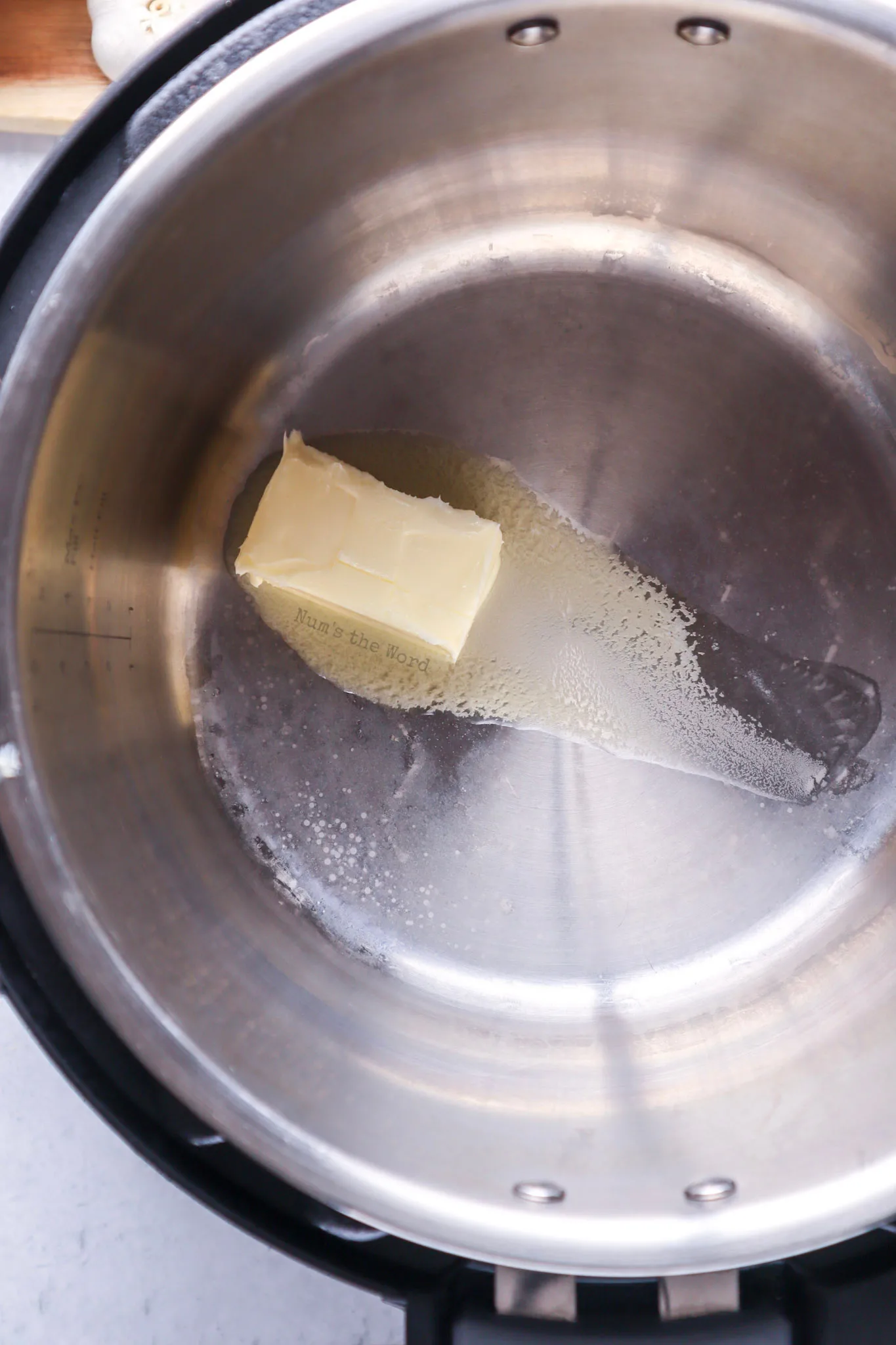 butter being melted in an instant pot