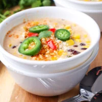 side view of soup with toppings and ready to enjoy.