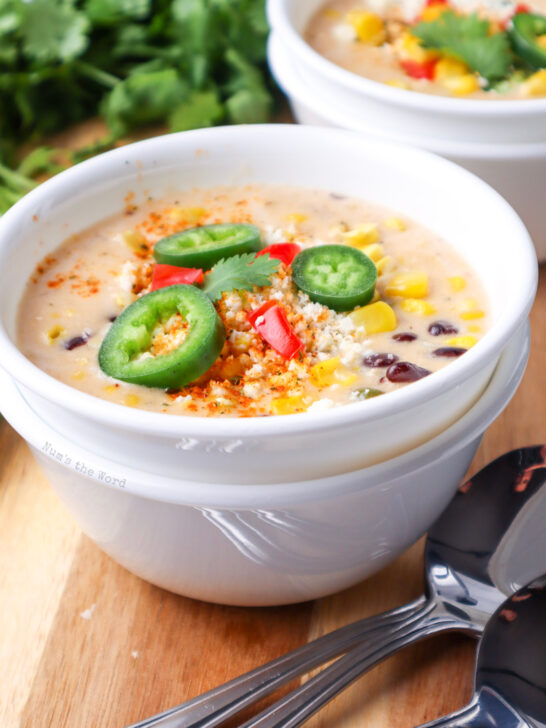 side view of soup with toppings and ready to enjoy.