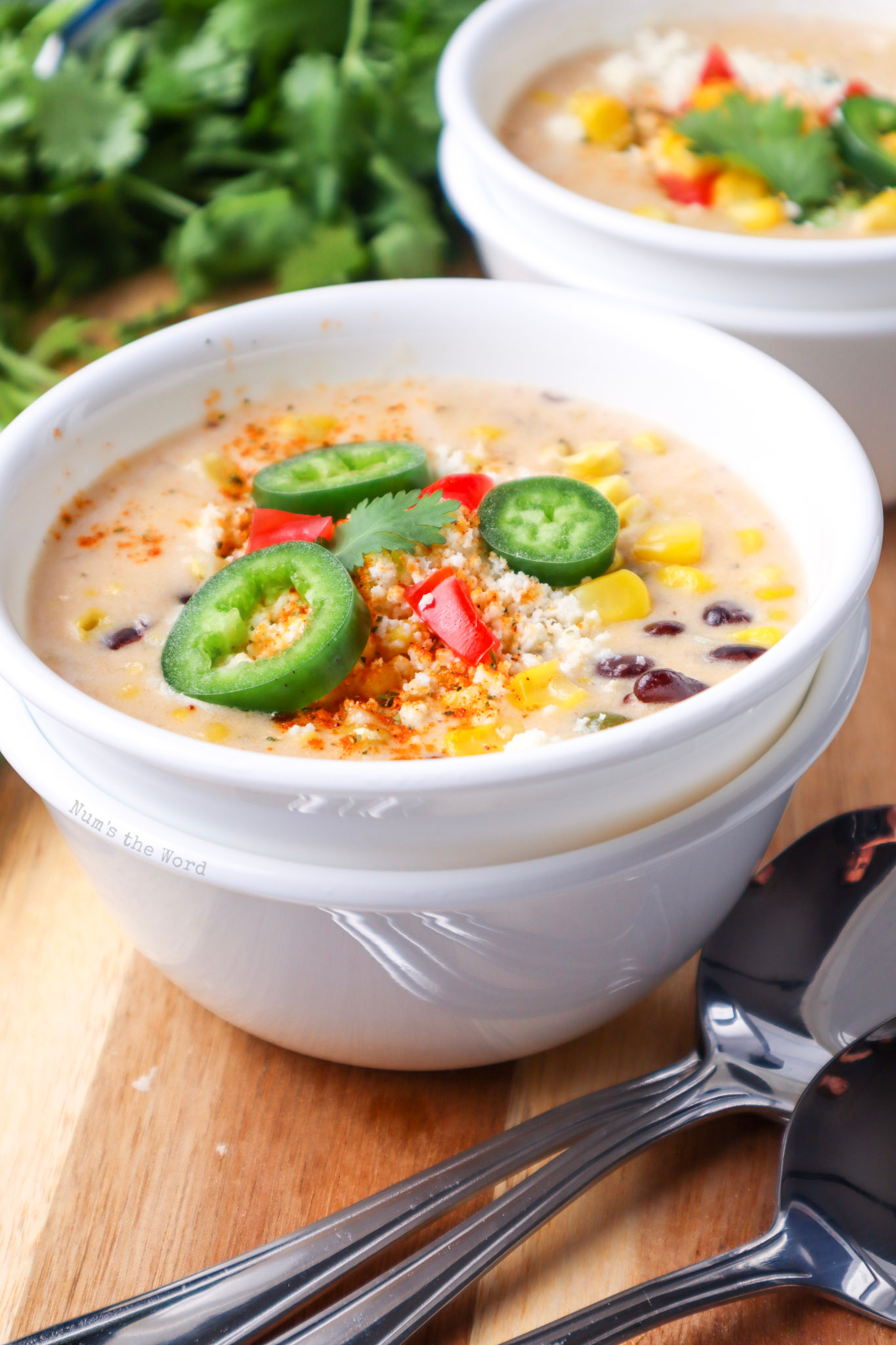 side view of soup with toppings and ready to enjoy. 