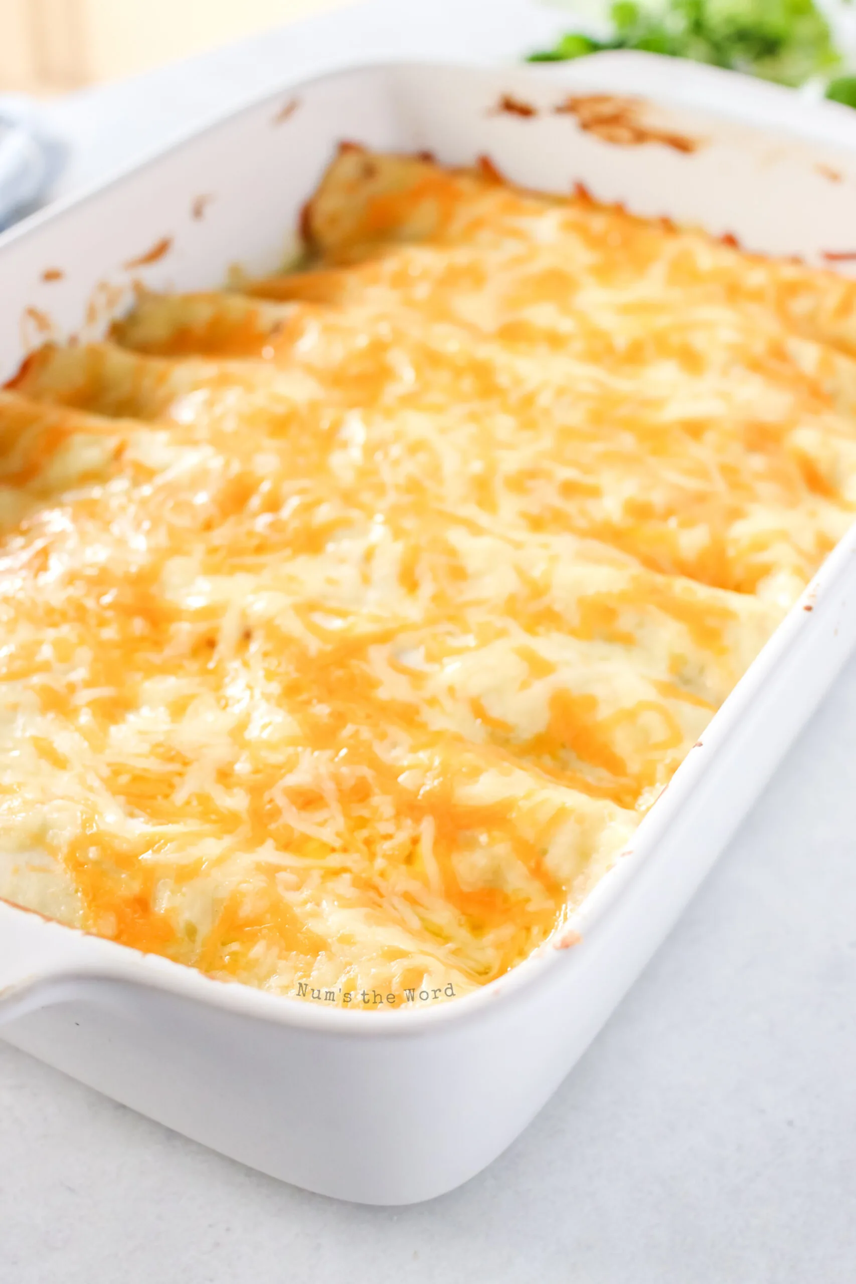 cooked enchiladas in casserole dish, ready to serve.