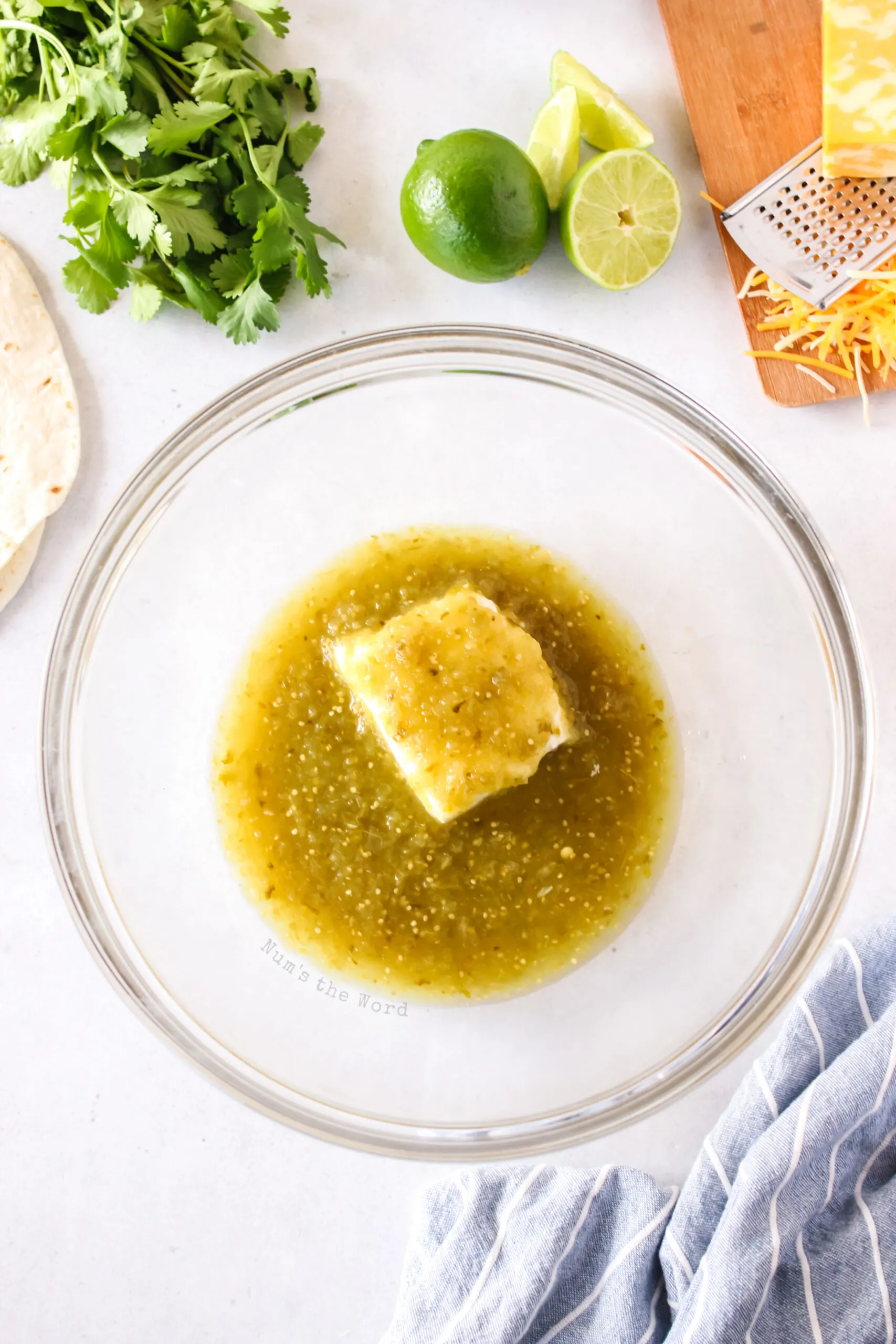 cream cheese and salsa verde in a bowl, unmixed, but soon to be mixed.