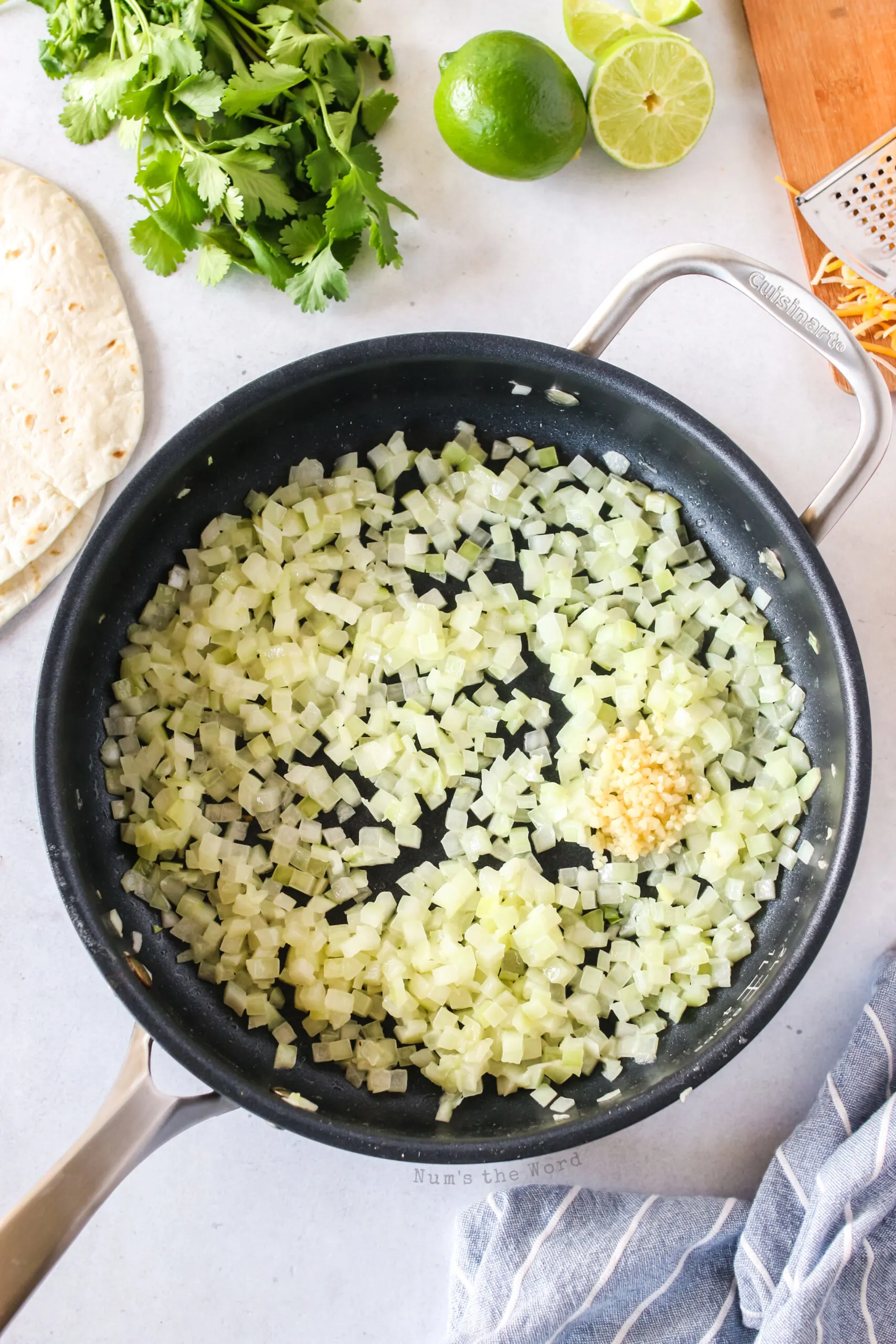 butter and onion cooked in skillet with garlic added.