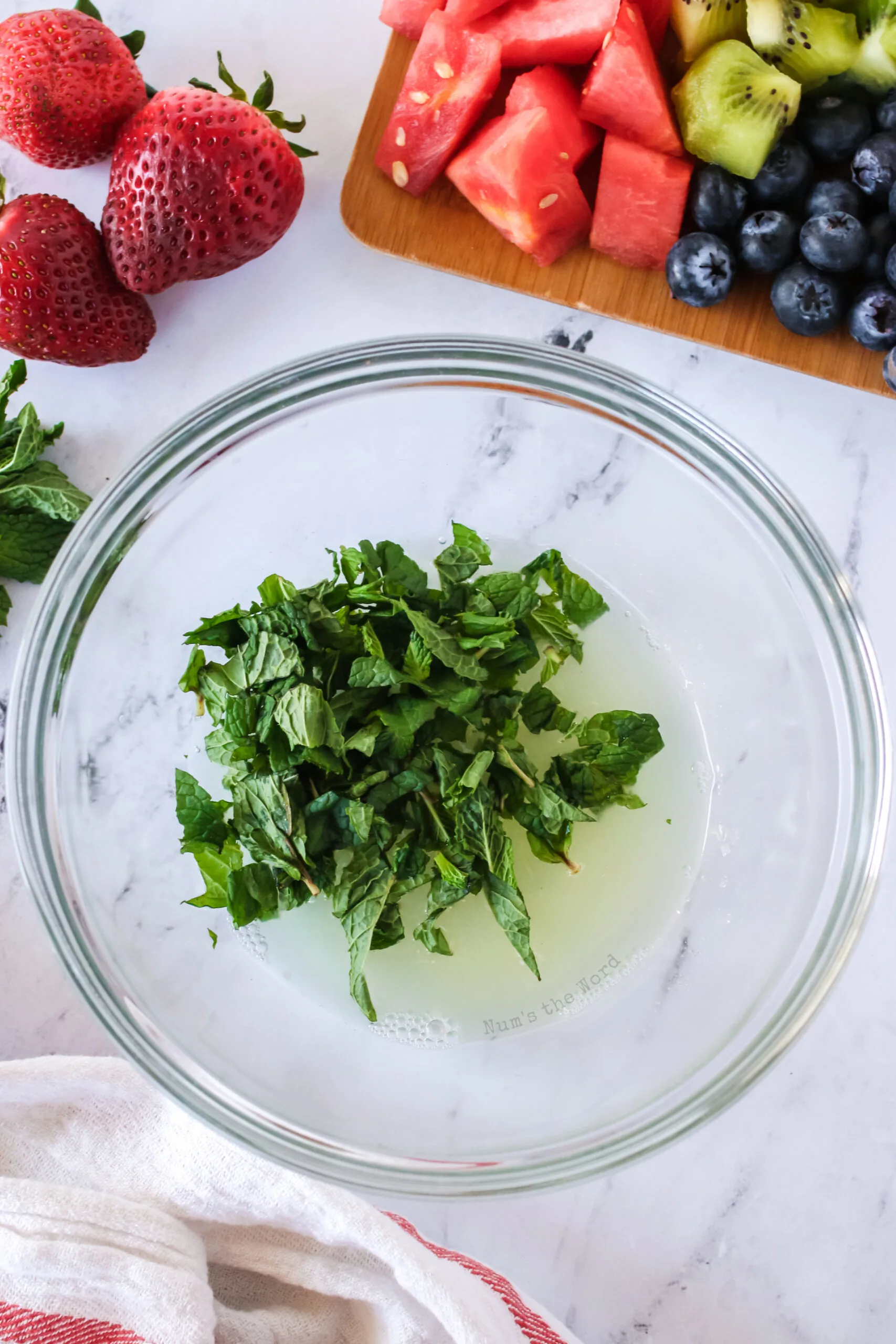 fresh mint leaves and lime juice in a bowl.