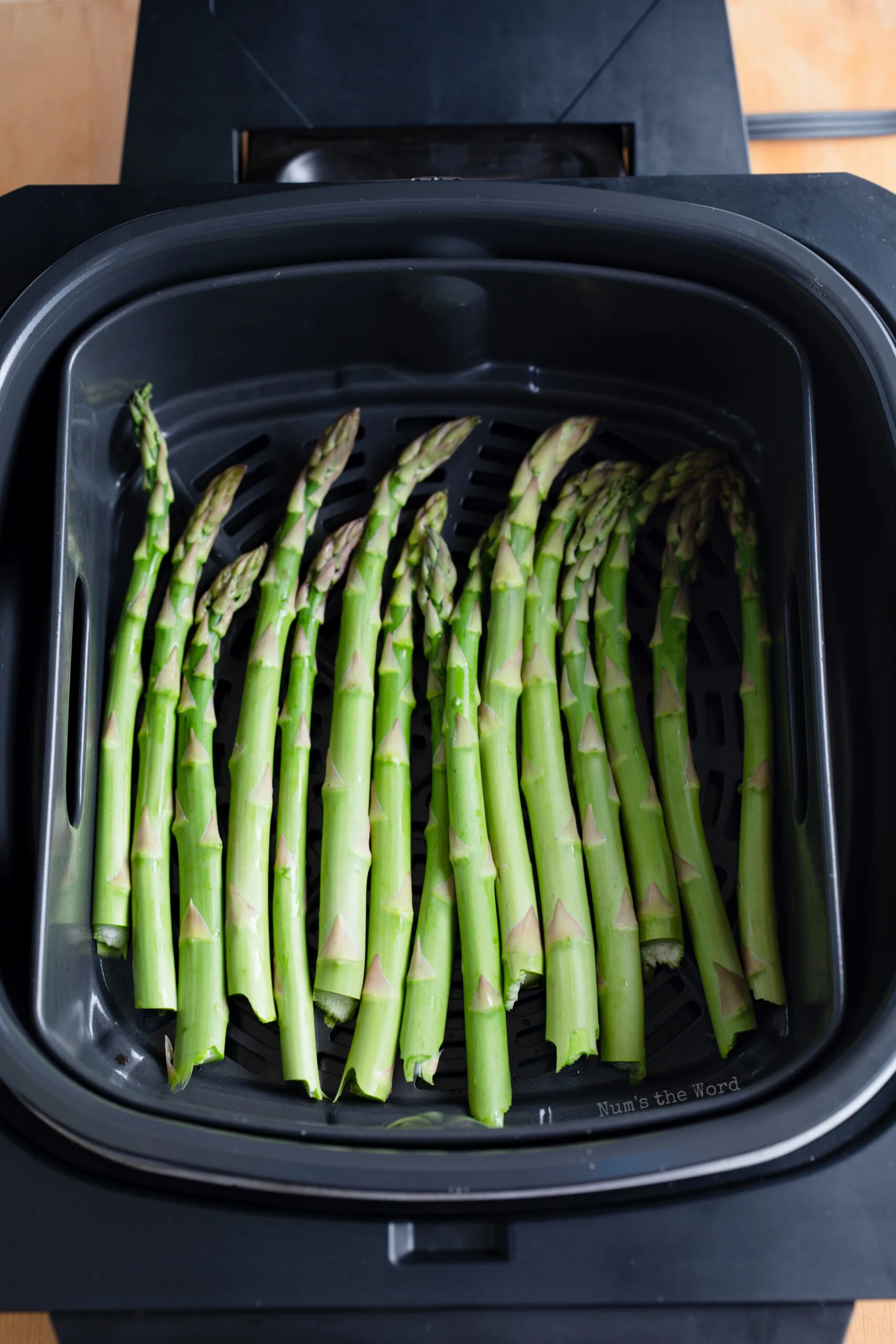 Asparagus in air fryer, uncooked.