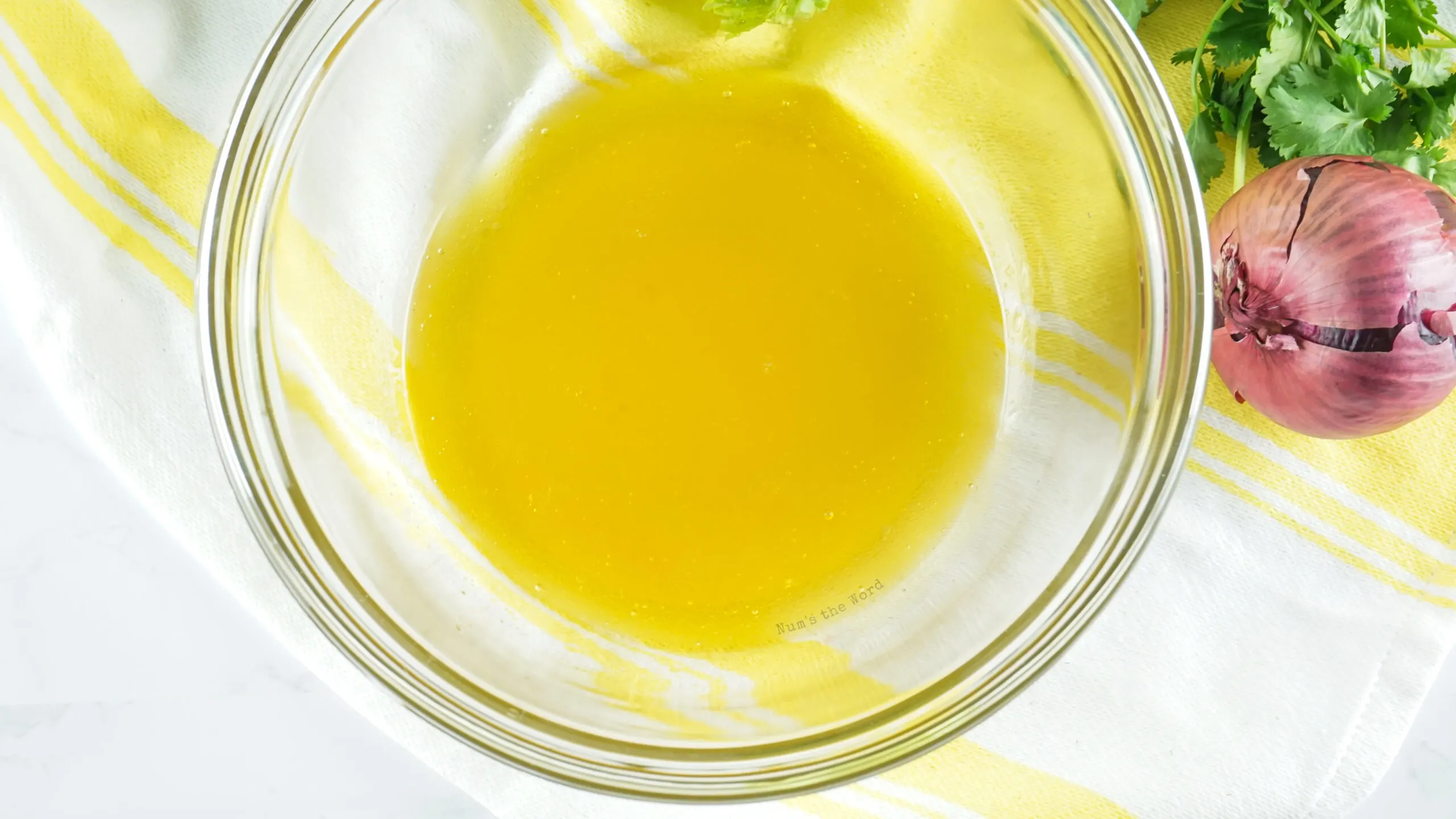 dressing whisked together in a bowl, ready to pour over salad.