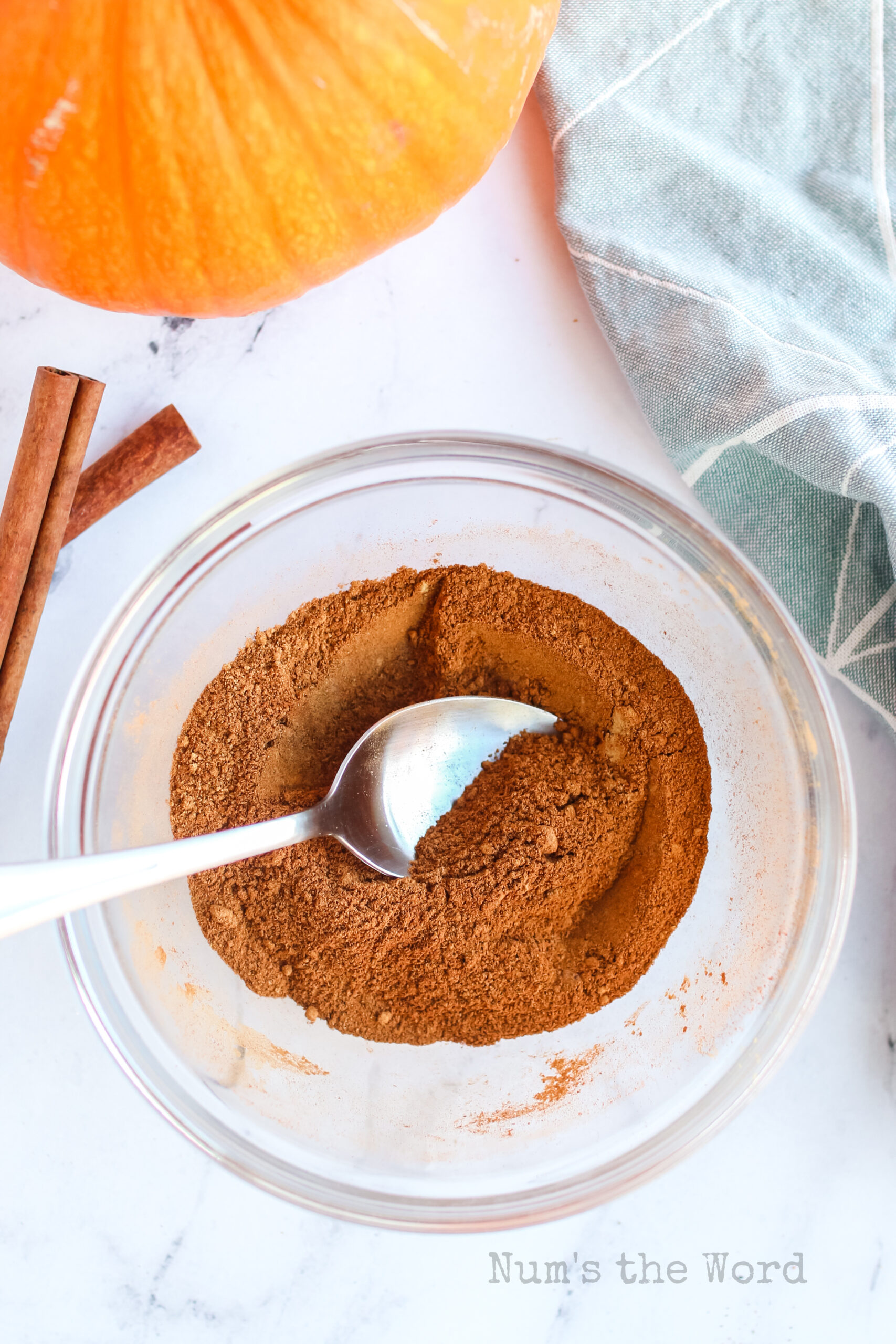 Spice seasoning mixed in a bowl with a spoon.