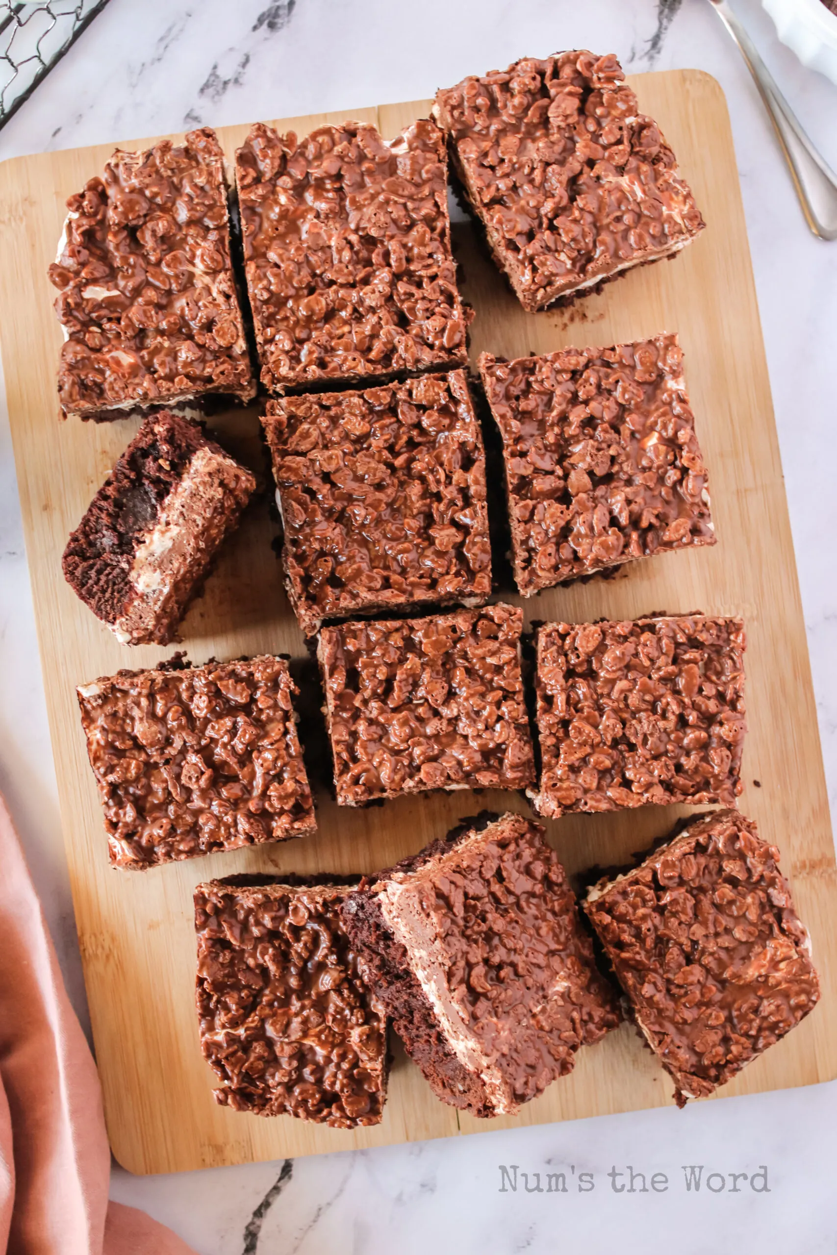 12 sliced brownies on a cutting board.