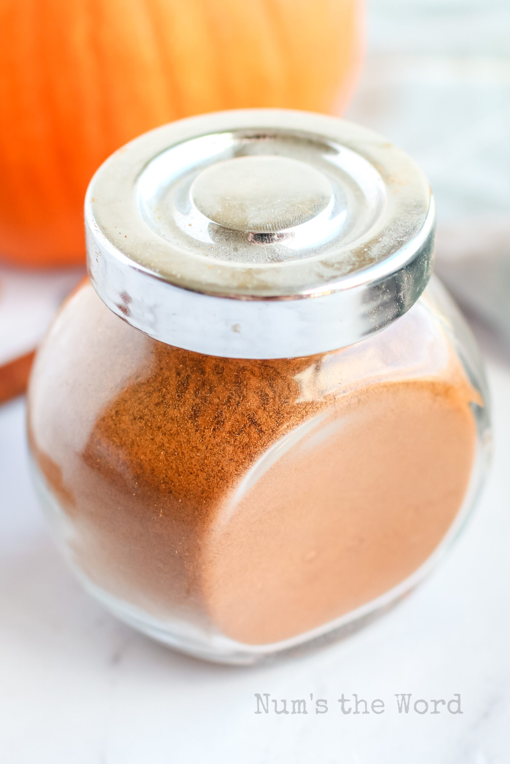 top angled view of seasoning in a jar with the lid on.