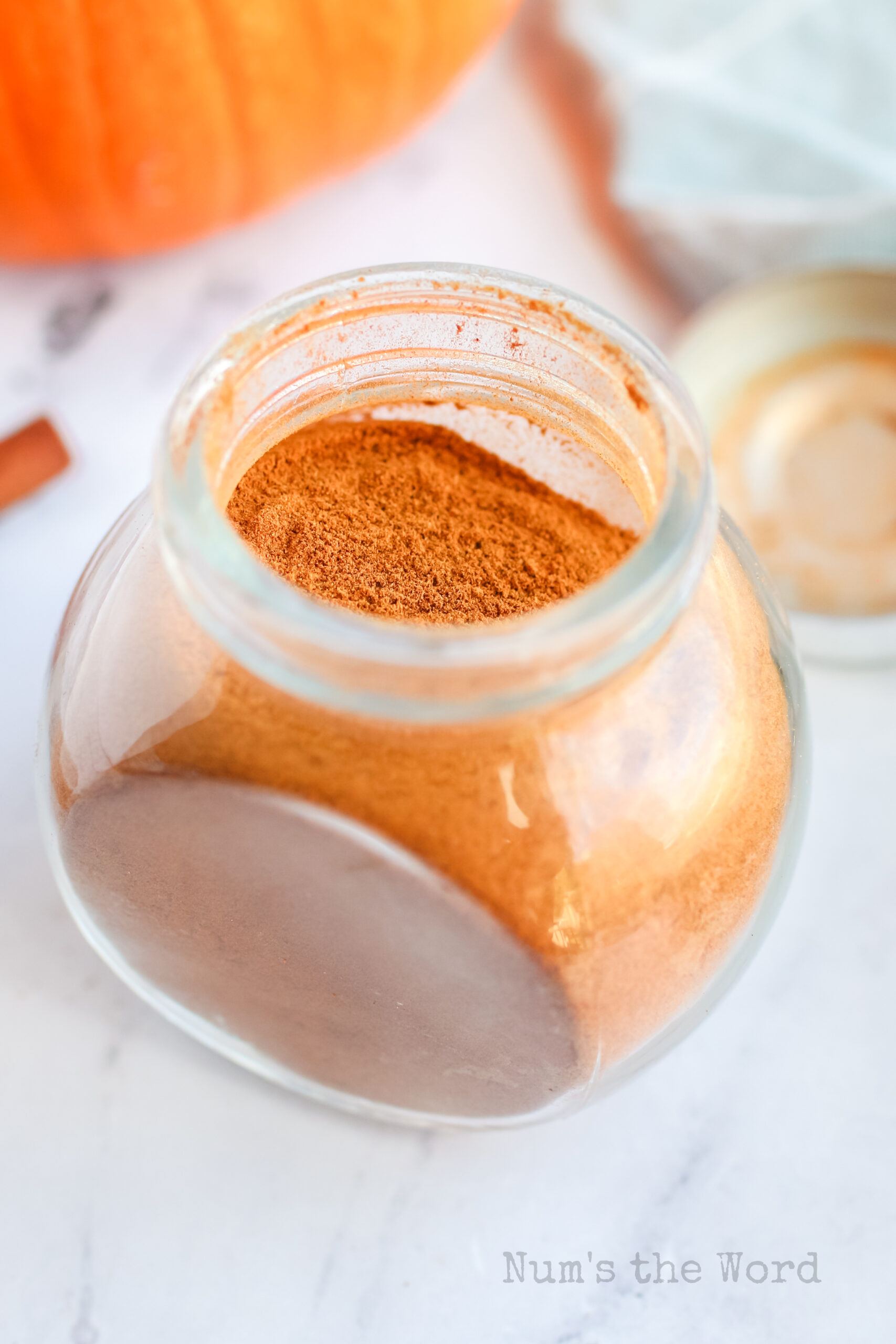 Side angled view of pumpkin spice in a jar.