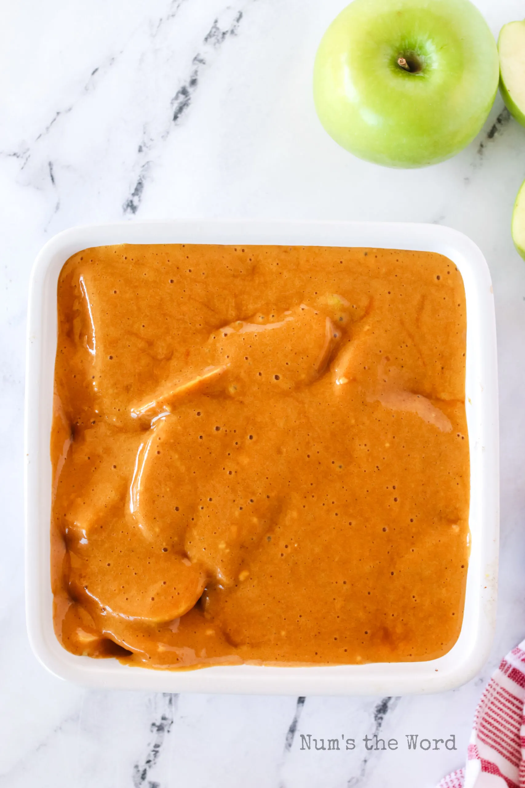 gingerbread cake mix poured over apples, unbaked