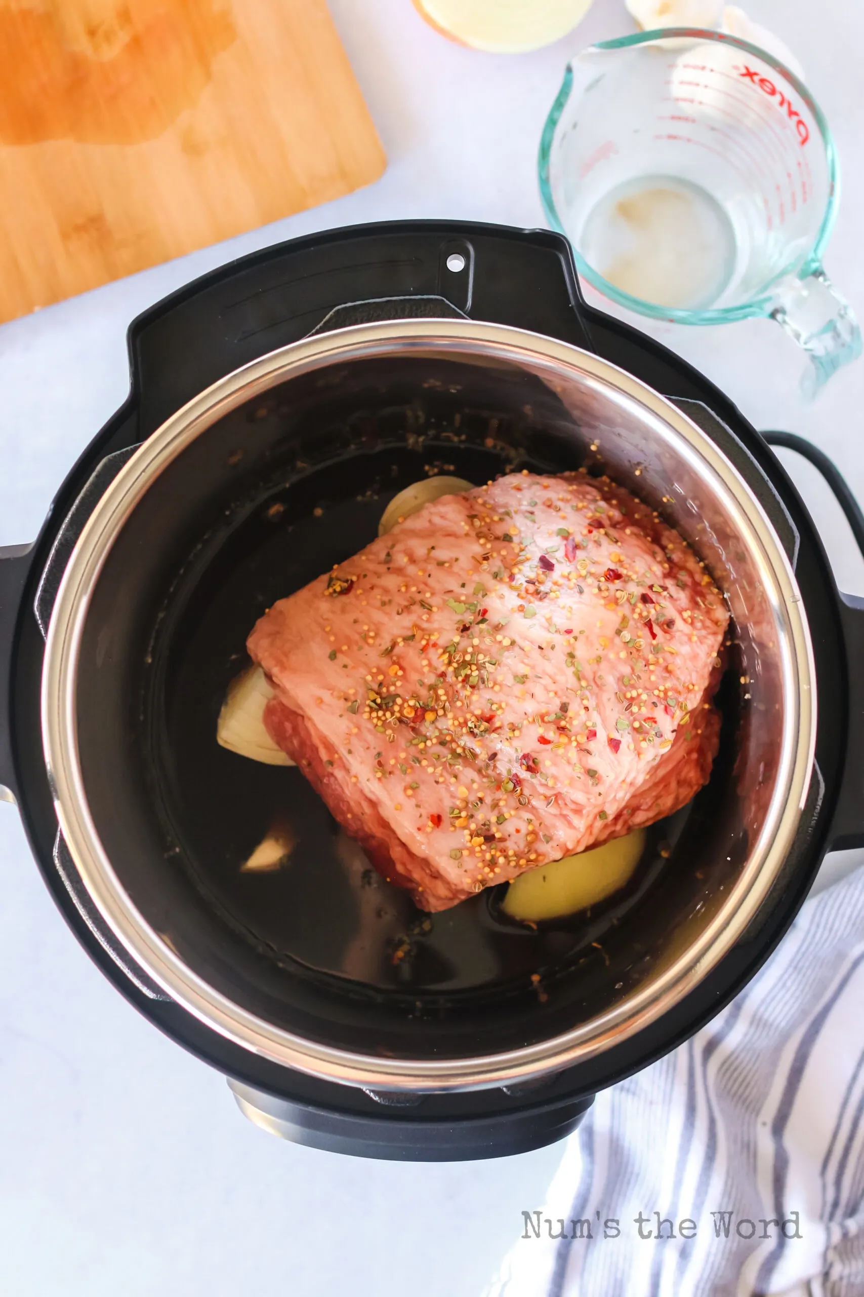 garlic, brown sugar, worcestershire sauce and beef broth added to corned beef slab.