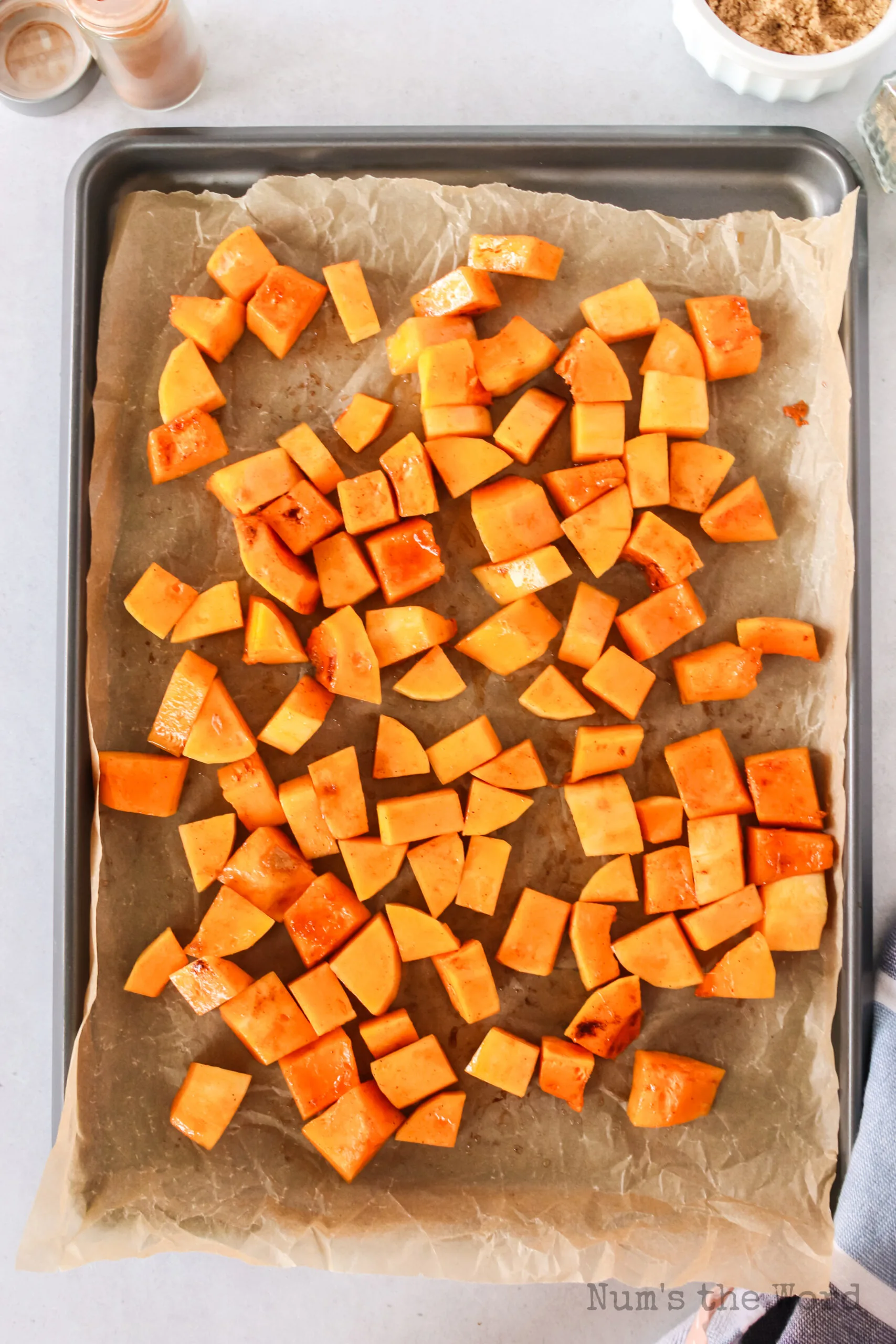 oiled squash on a cookie sheet with parchment paper, uncooked