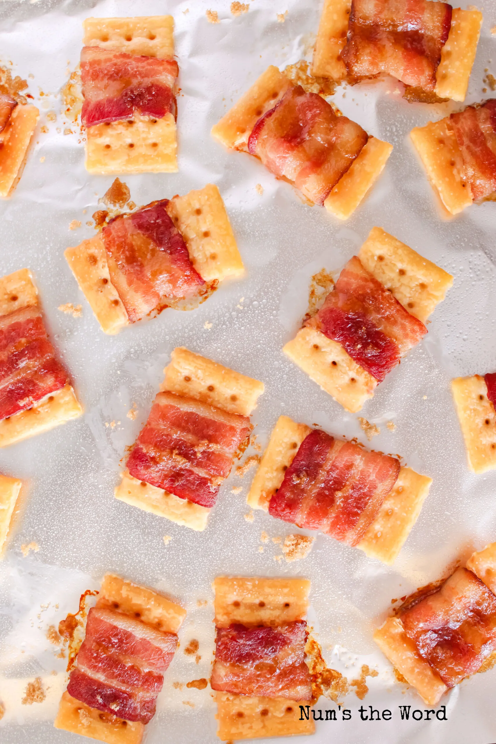 fully cooked bacon crackers on cookie sheet, ready to serve.
