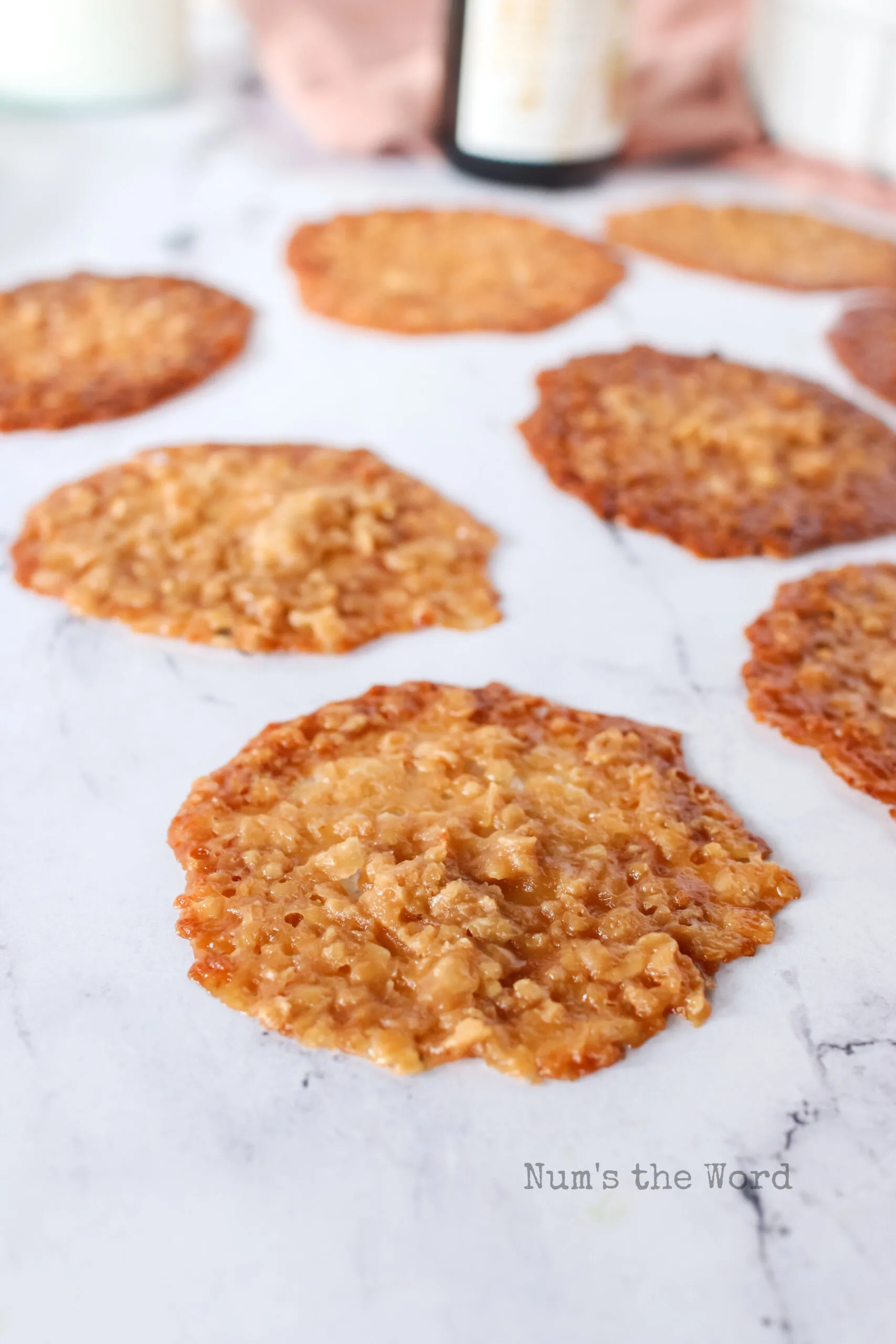 Cookies laid out on counter to show how thin they are.