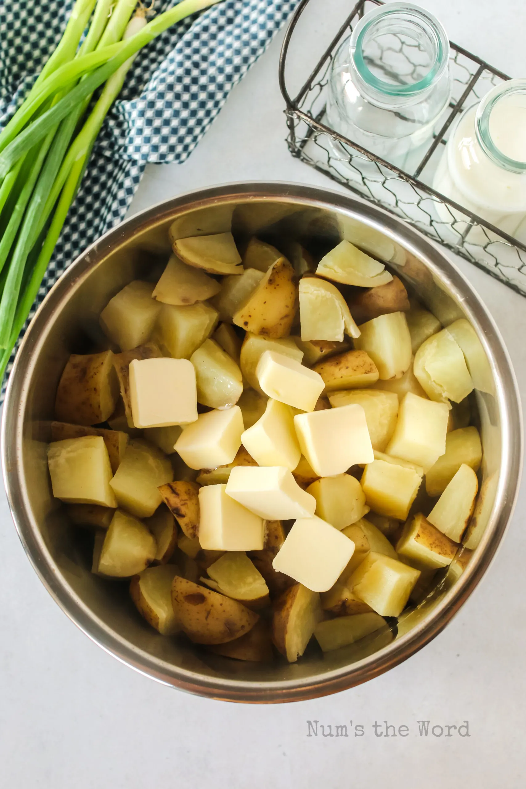 Butter added to cooked potato cubes