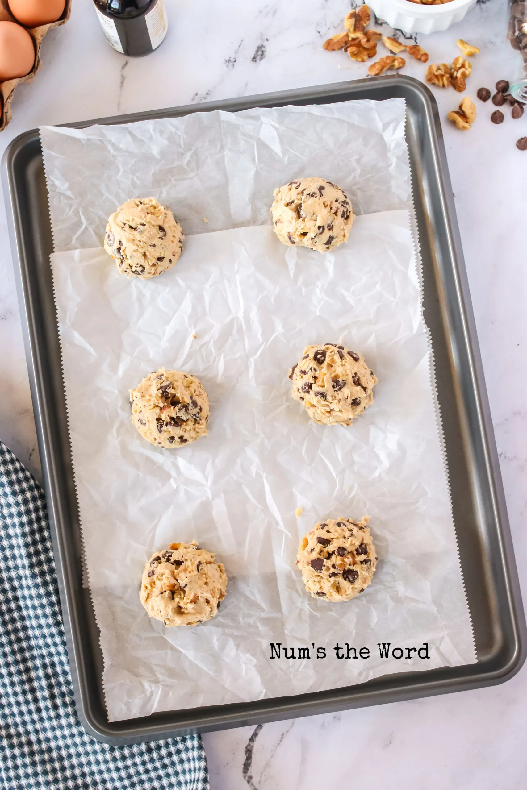 cookies scooped onto a cookie sheet