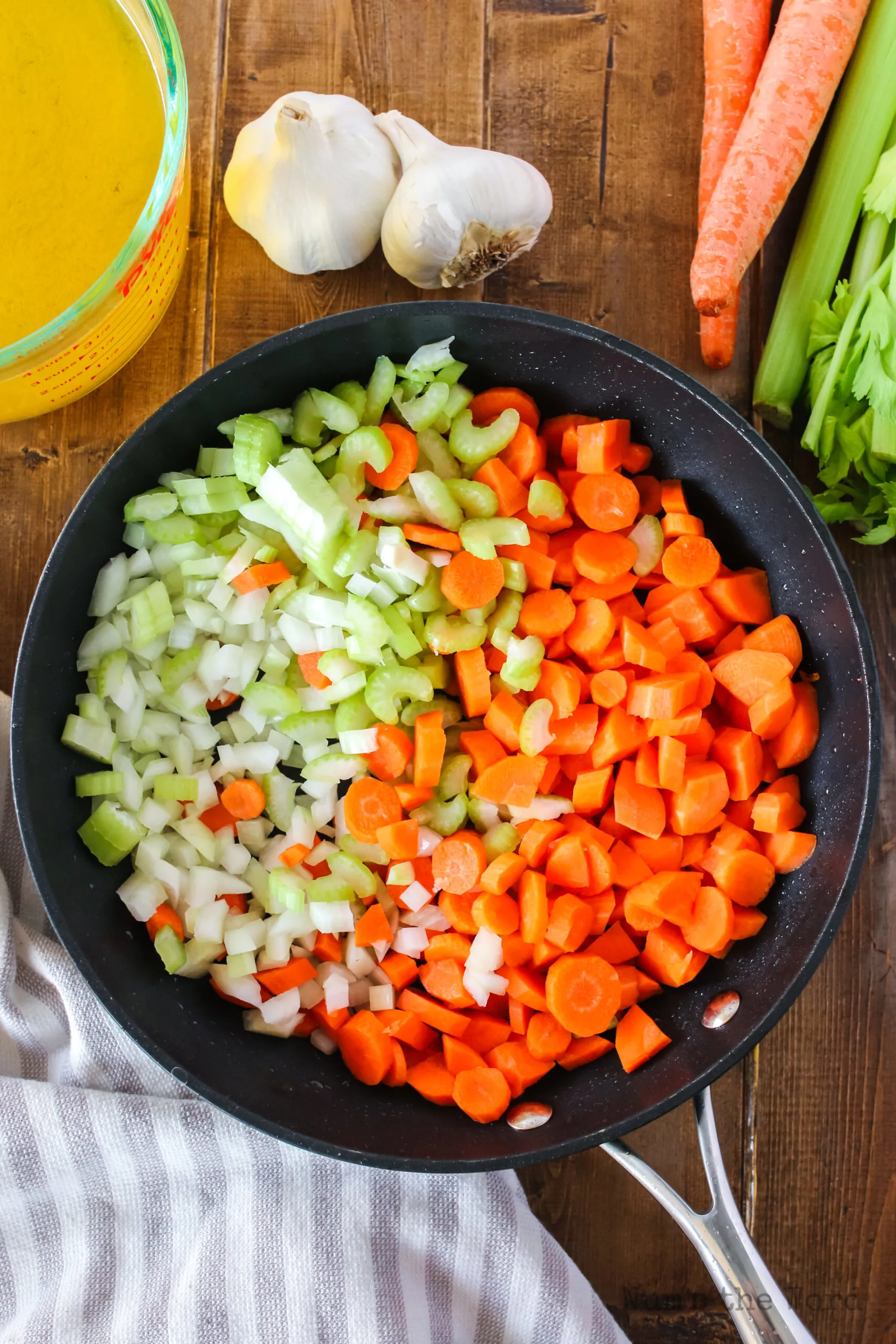 celery, carrots and onion in a skillet