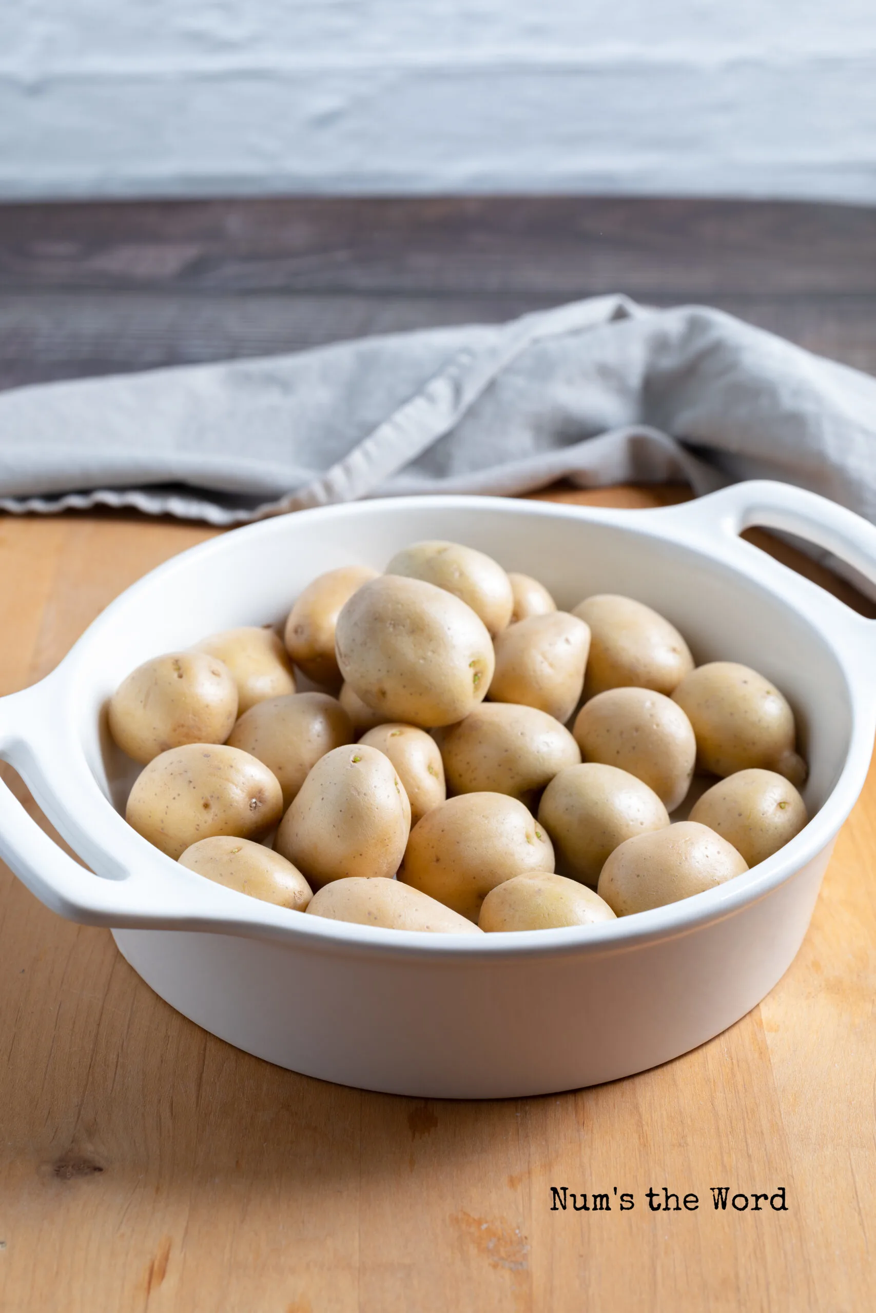 uncooked baby potatoes in a bowl, washed and cleaned.
