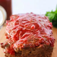 front view of meatloaf on a cutting board, uncut.