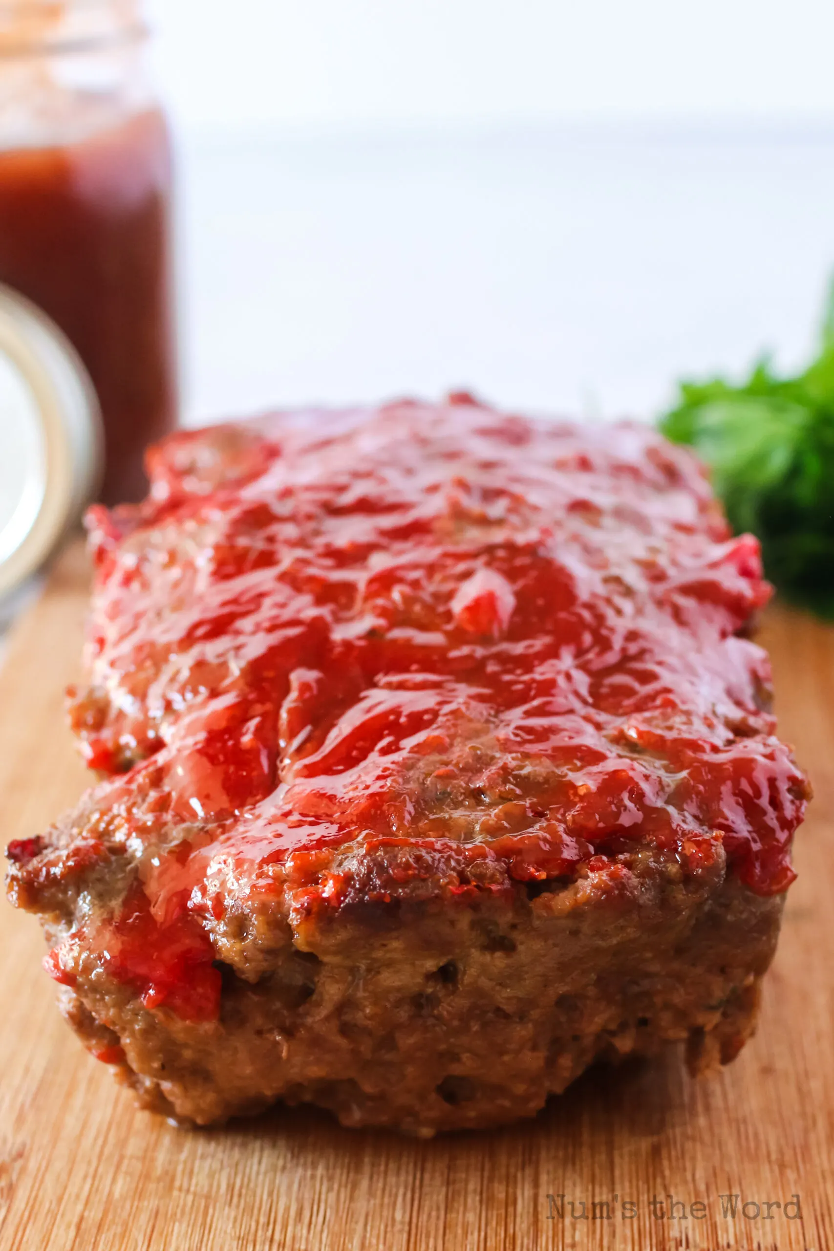 front view of meatloaf on a cutting board, uncut.