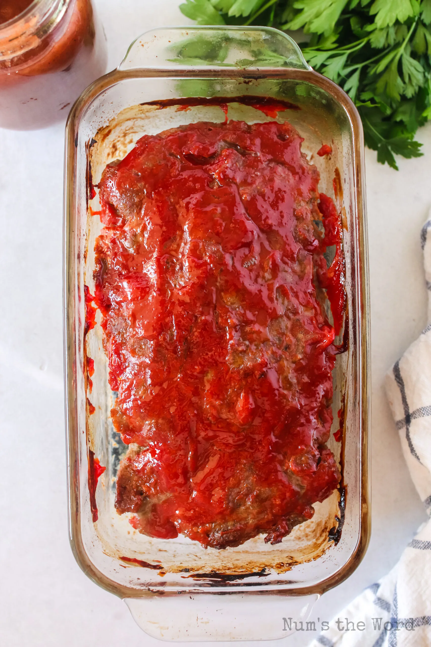 baked meatloaf in bread pan fresh out of the oven.