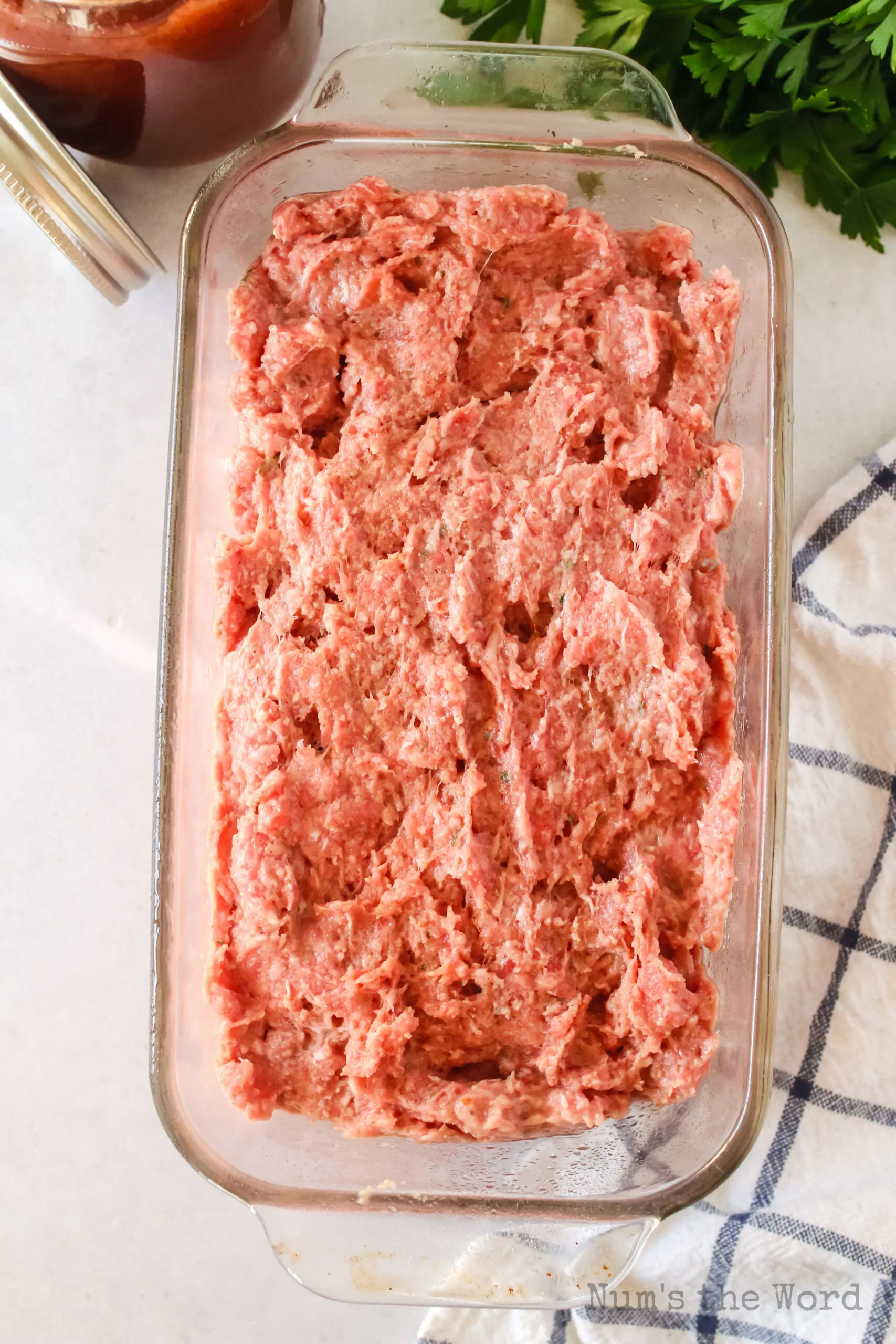 meatloaf pressed lightly into a bread loaf pan.