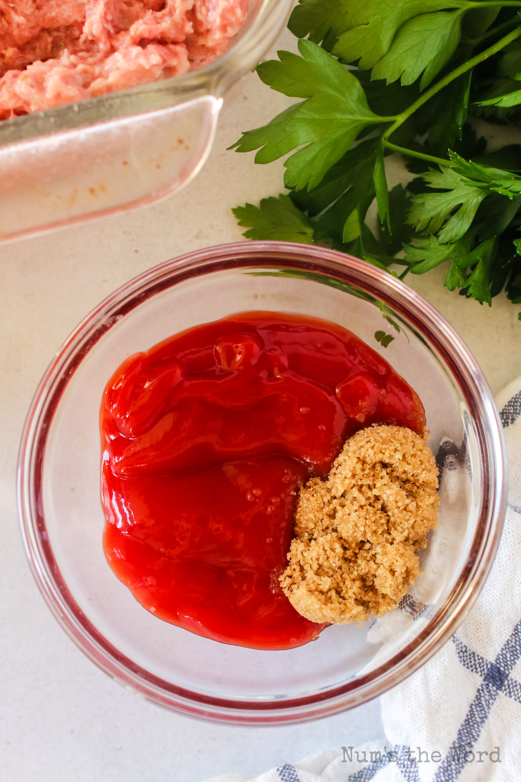 brown sugar and ketchup in a bowl, to make red sauce, unmixed