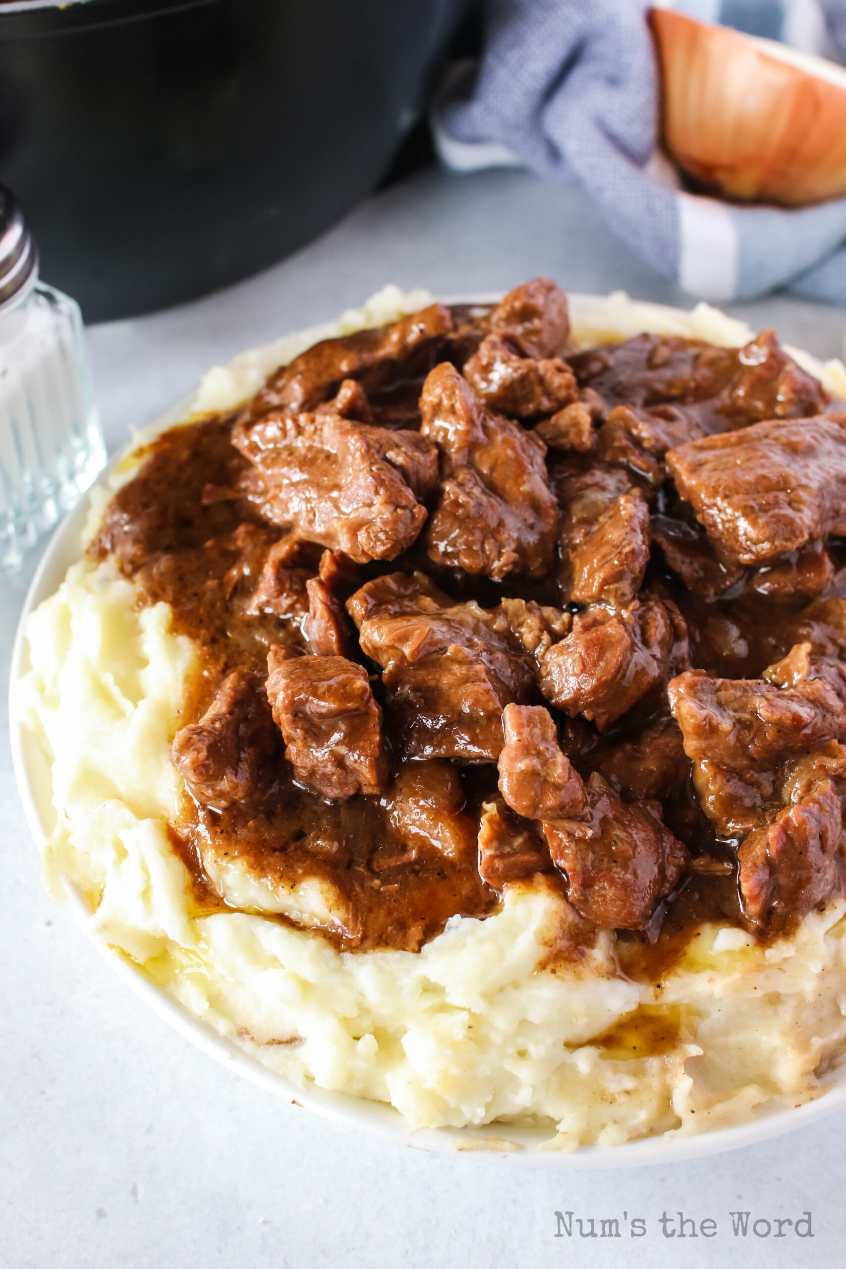 zoomed in image of beef tips over mashed potatoes