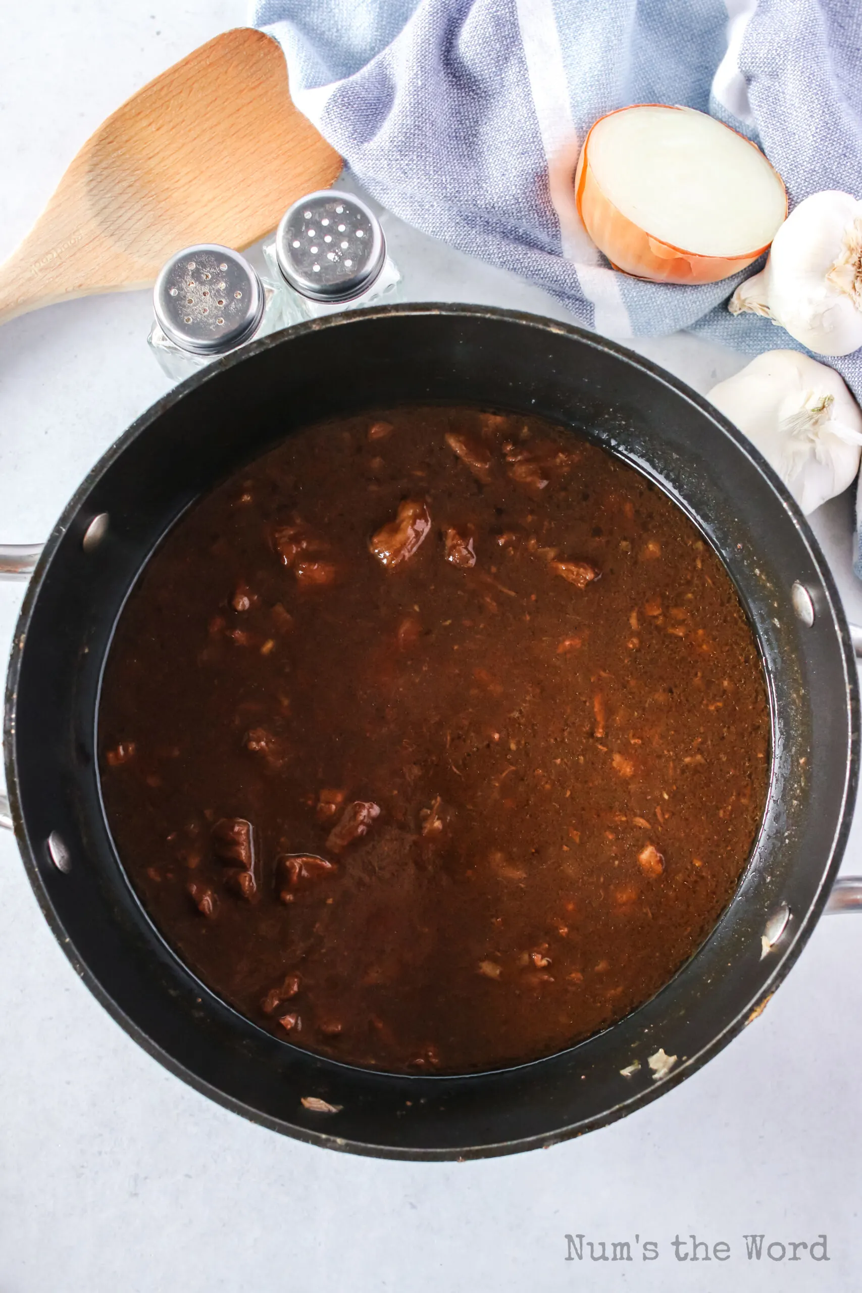 gravy broth added to pot to thicken sauce