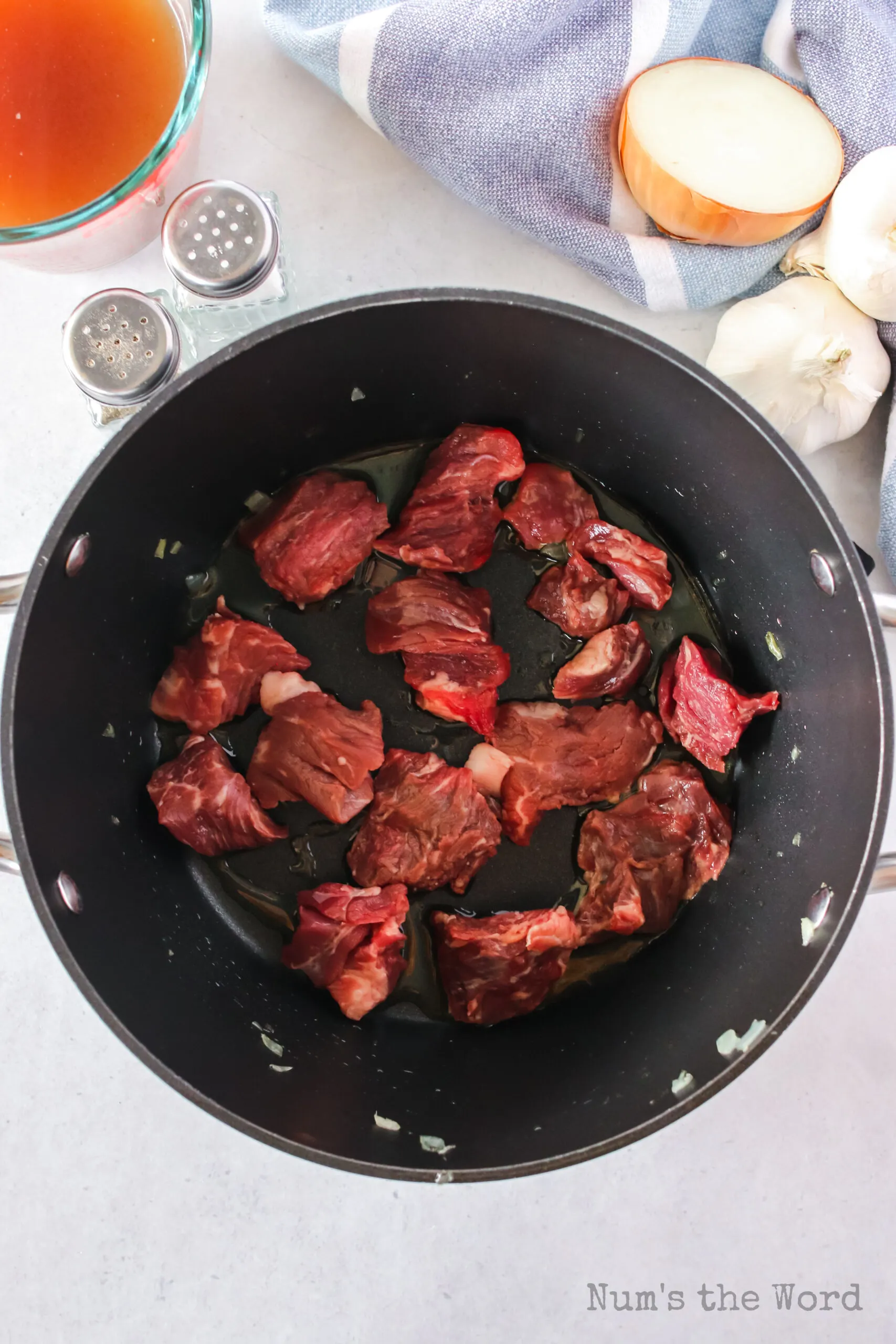 stew beef added to pot