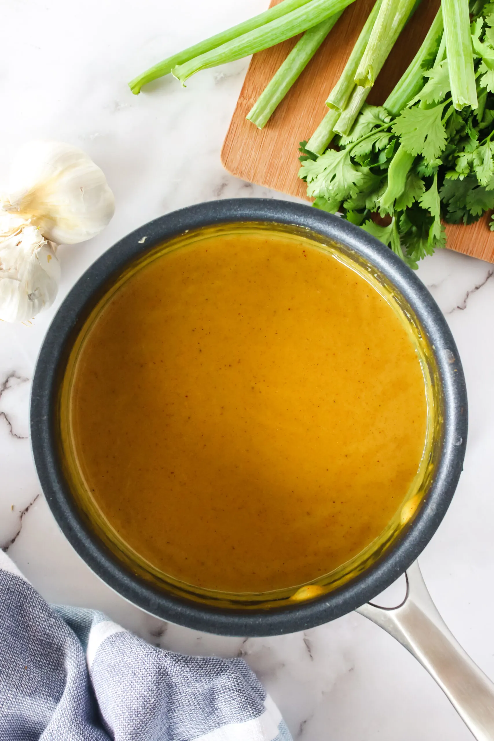 Peanut sauce in a pot, cooked and ready to serve.