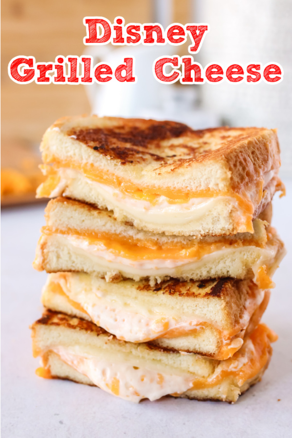 main image for recipe of Disney's grilled cheese cut in half with gooey insides dripping out.
