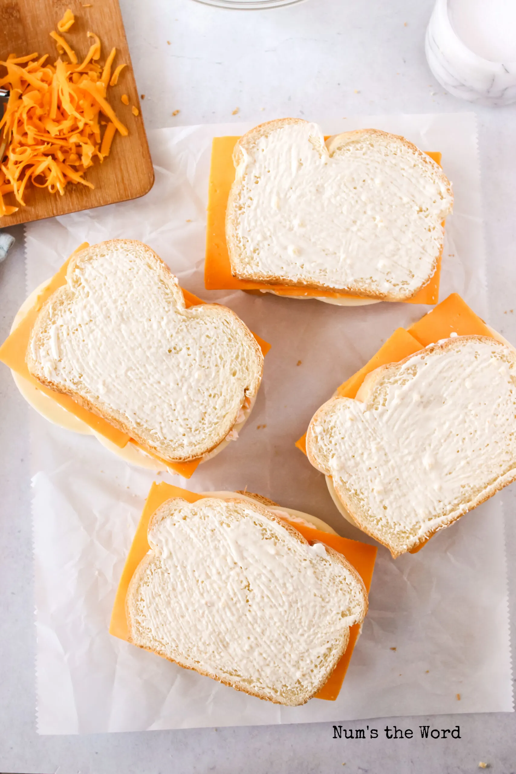 garlic spread covering top slice of bread