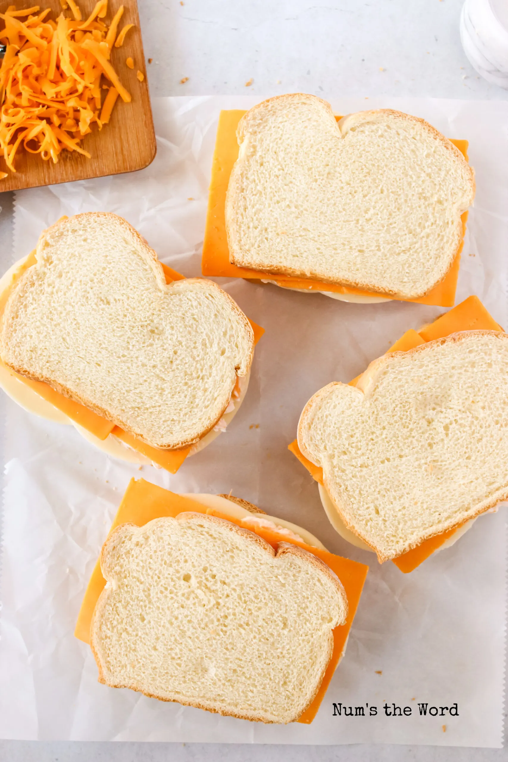 Top slice of bread placed on cheese slices