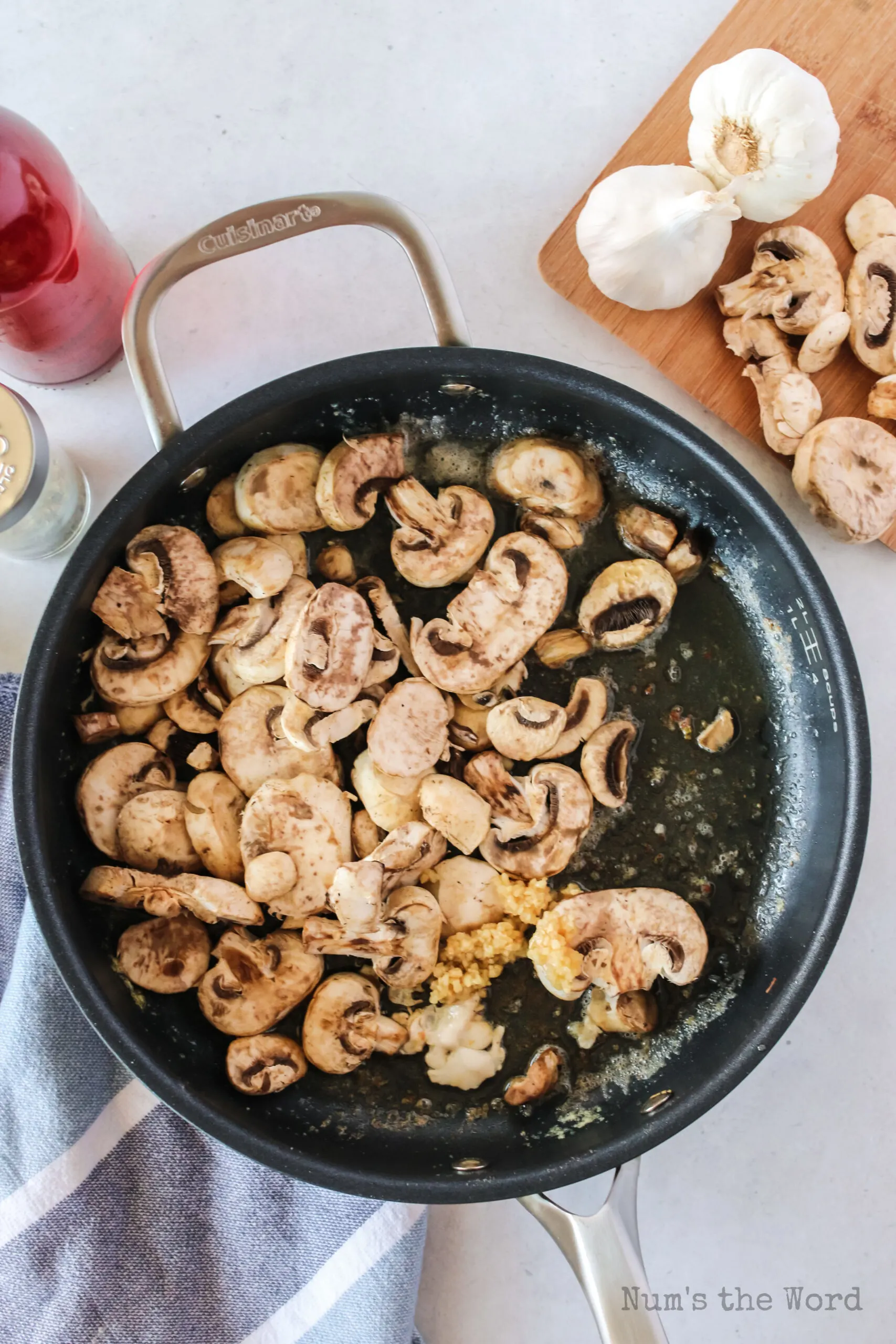 mushrooms cooking down in skillet