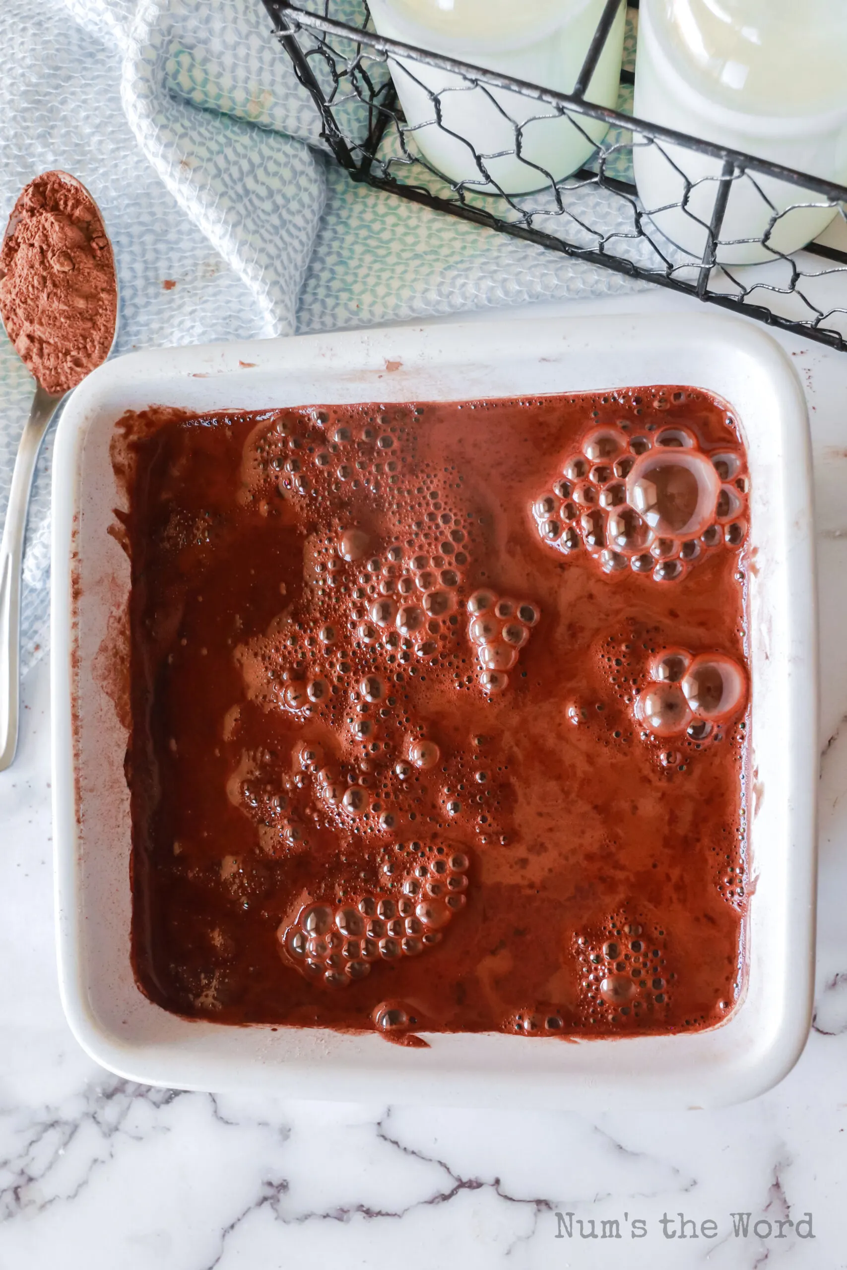 Boiling water poured over the top of the entire cake - but don't mix it in!