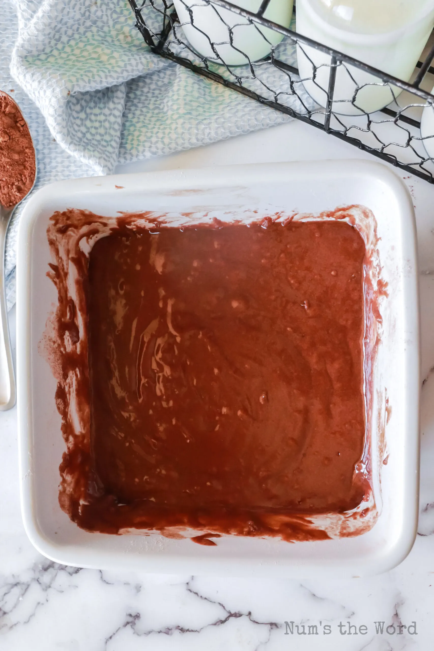 milk and vegetable oil mixed into the cocoa powder mixture in casserole dish.