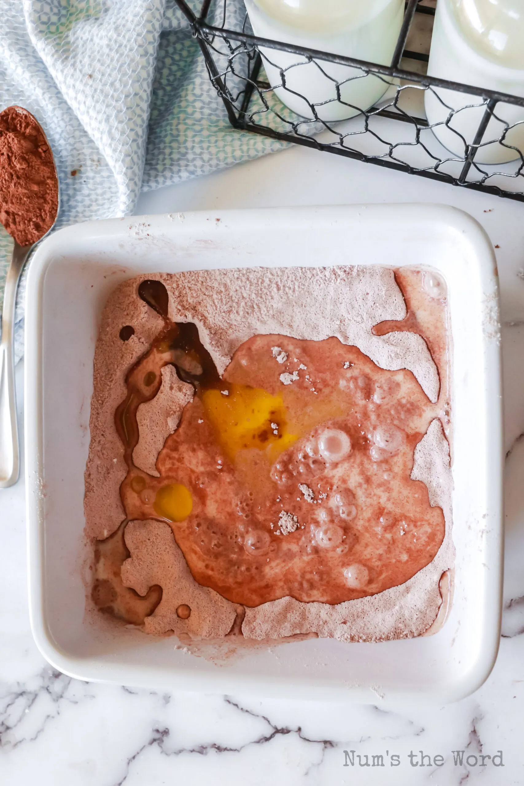 cocoa mixture mixed with milk and vegetable oil poured over the top.