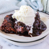 chocolate cobbler fresh out of the oven with a scoop of vanilla ice cream on top