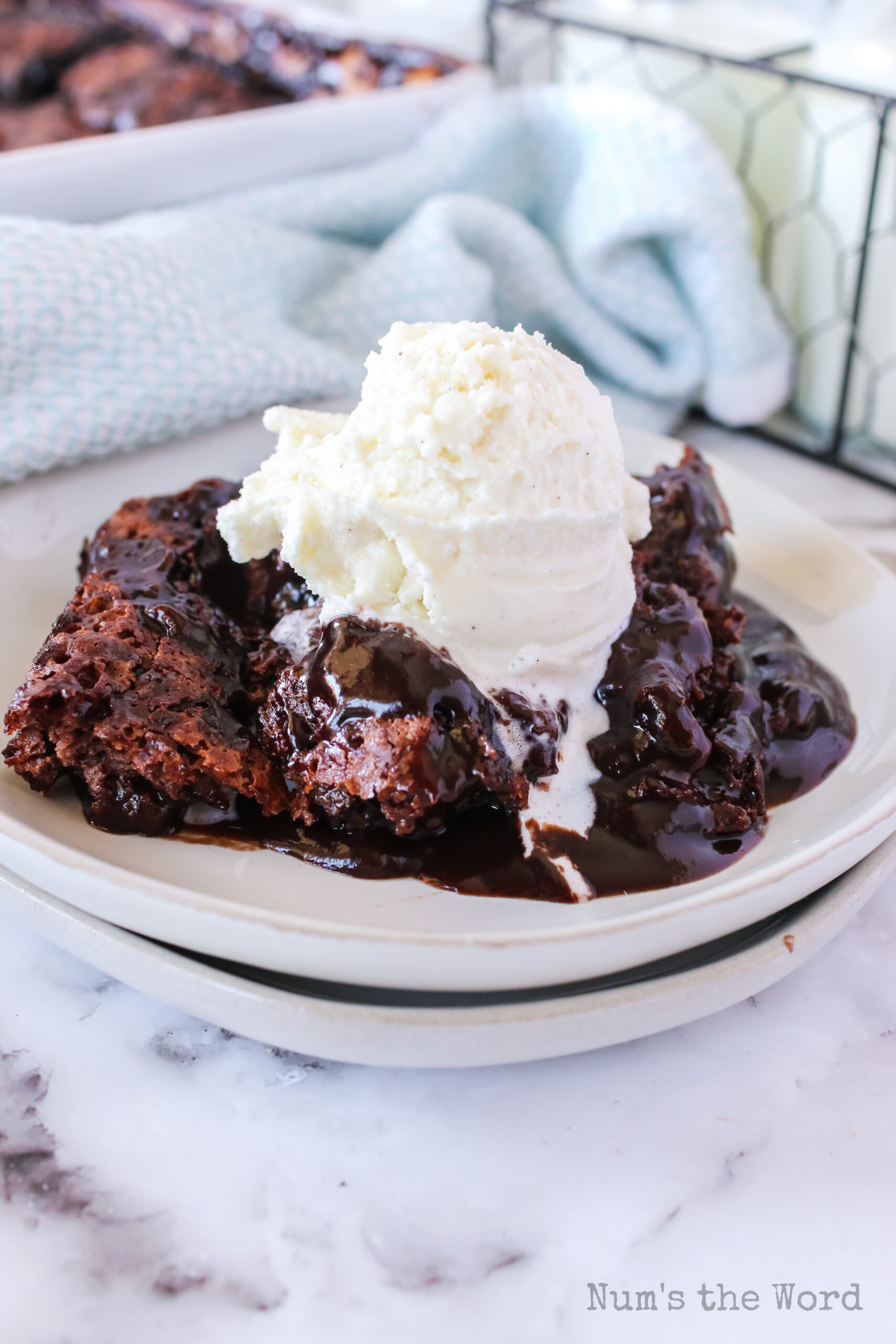 chocolate cobbler fresh out of the oven with a scoop of vanilla ice cream on top