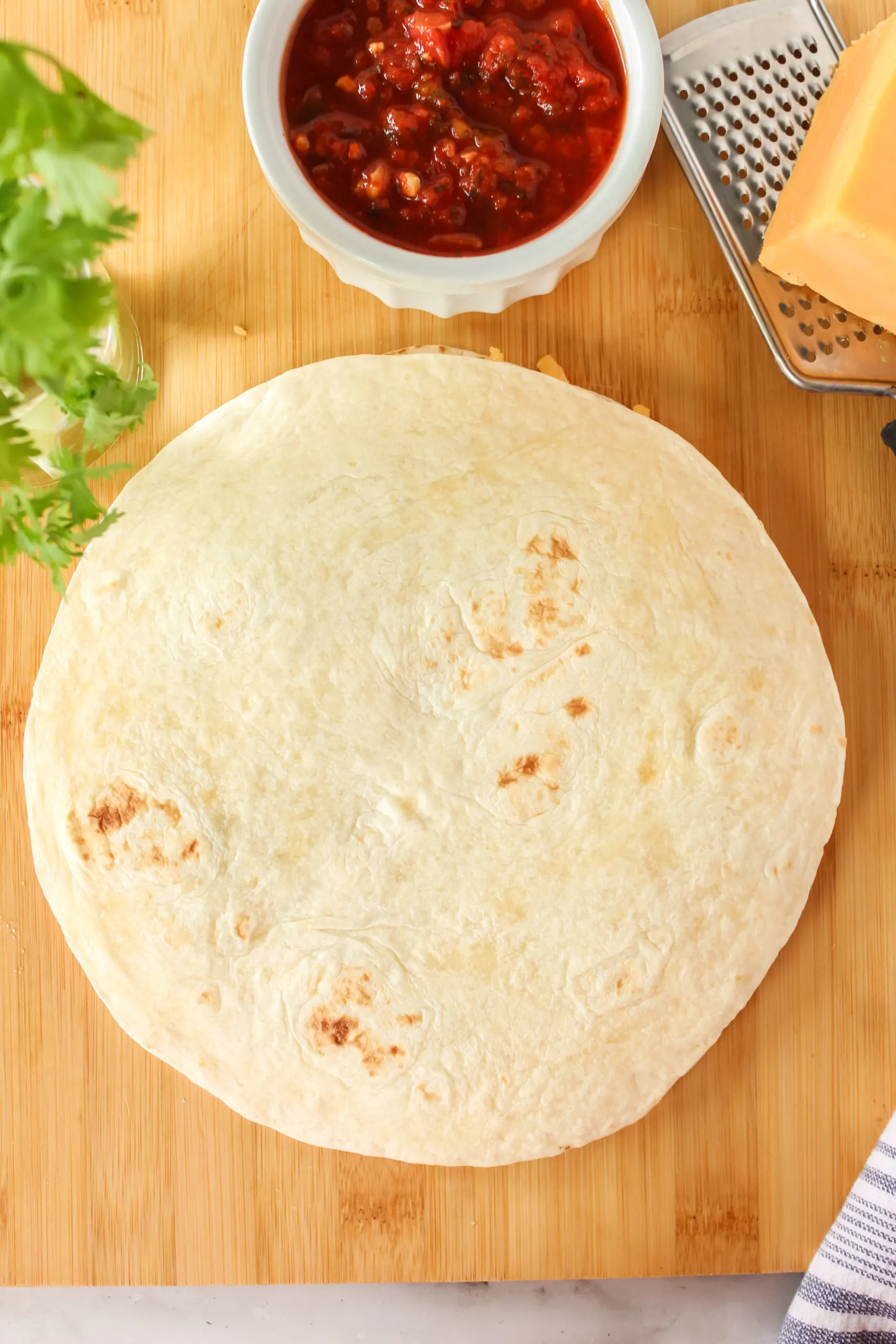 tortilla placed on top of ingredients