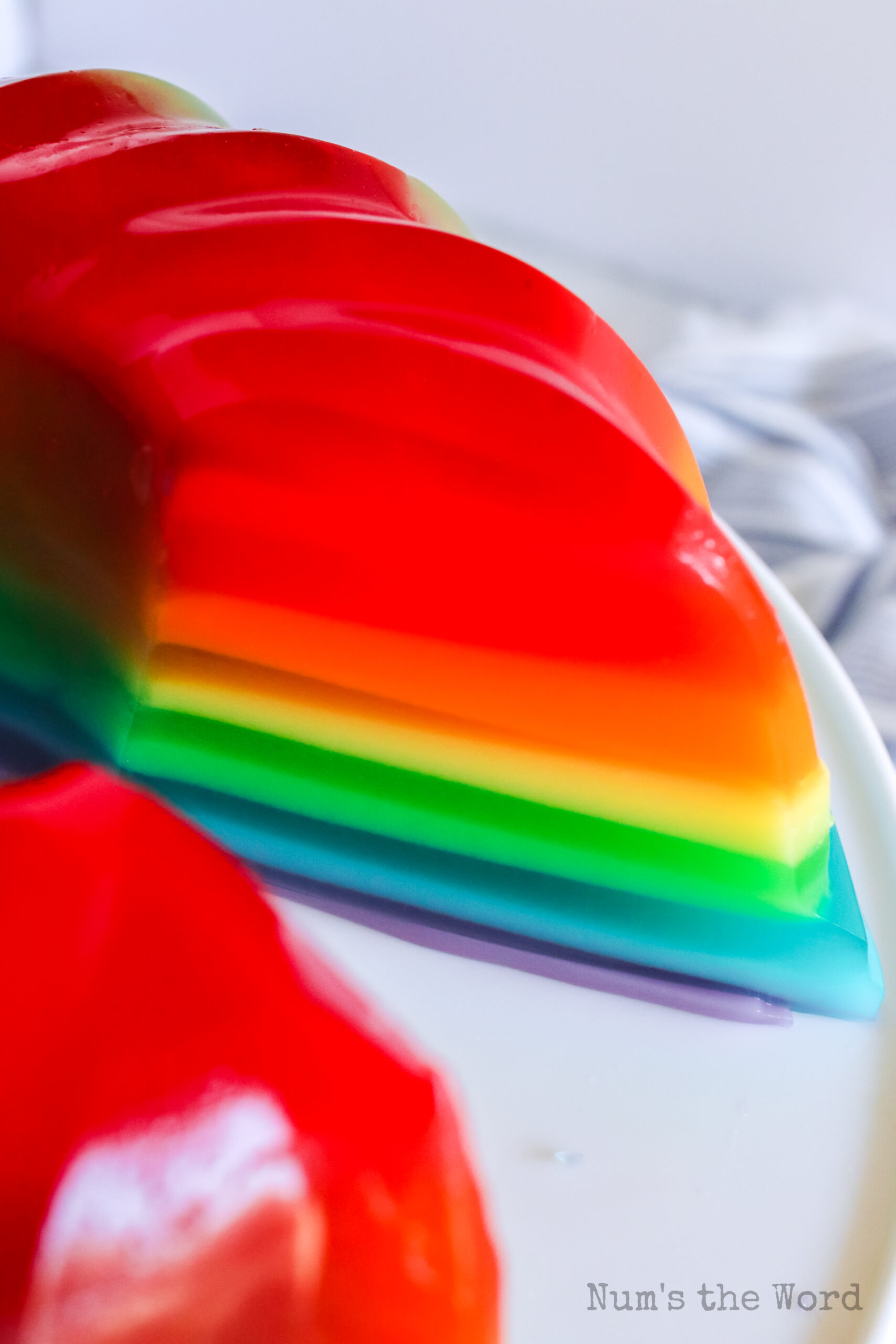 a large slice removed from jello to show layers.