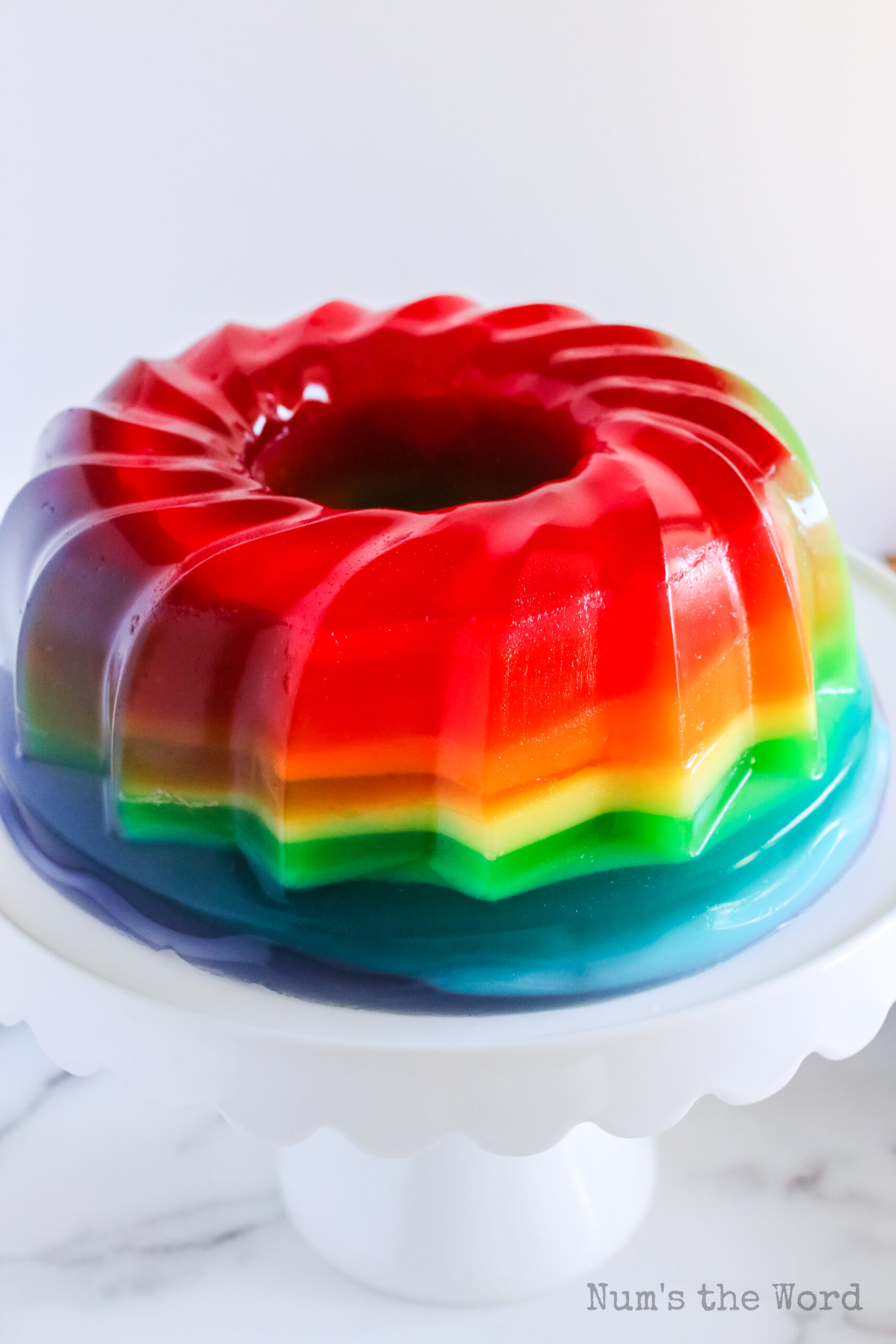 zoomed out image of jello fresh from the mold and on a platter, ready to be sliced and served