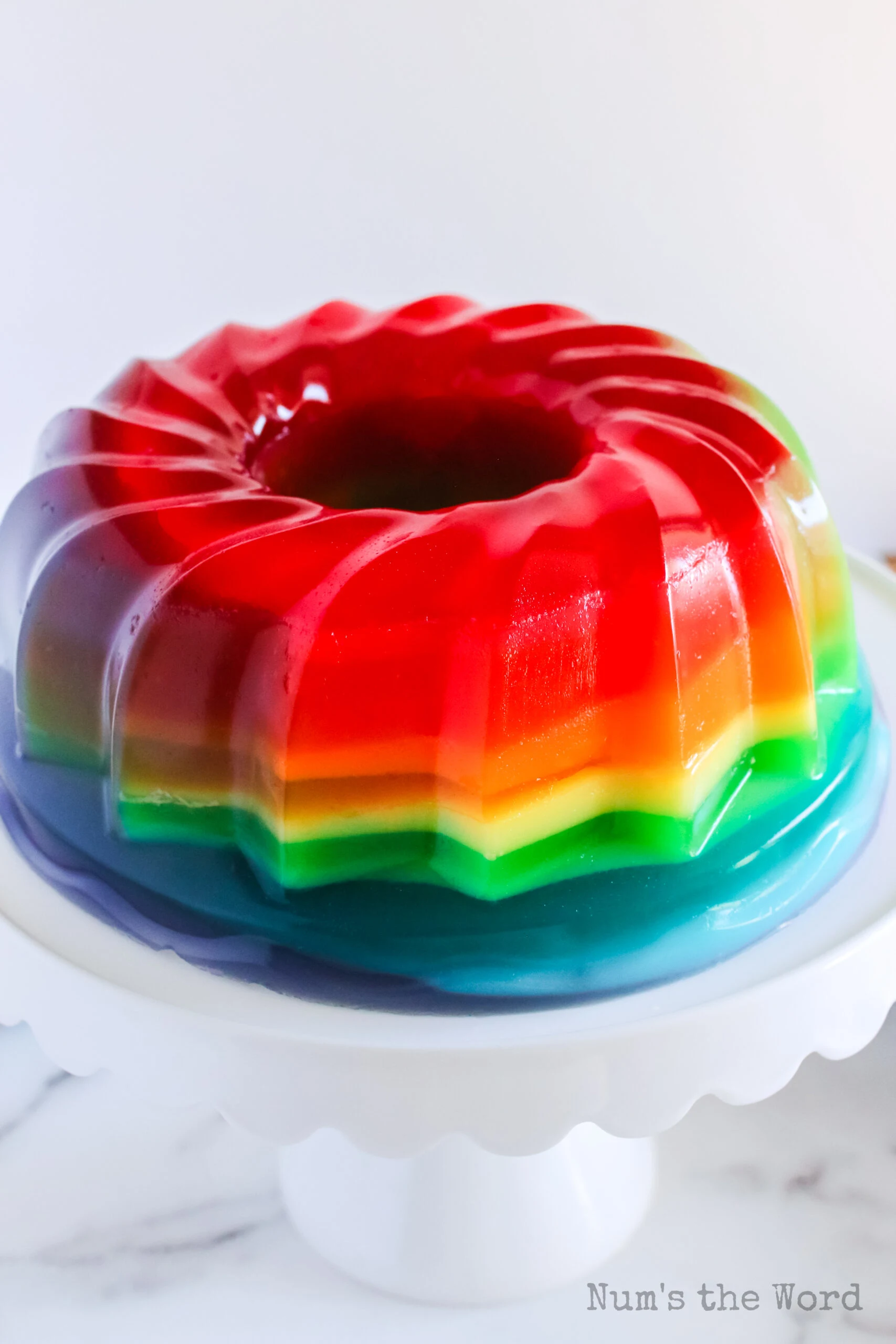 zoomed out image of jello fresh from the mold and on a platter, ready to be sliced and served