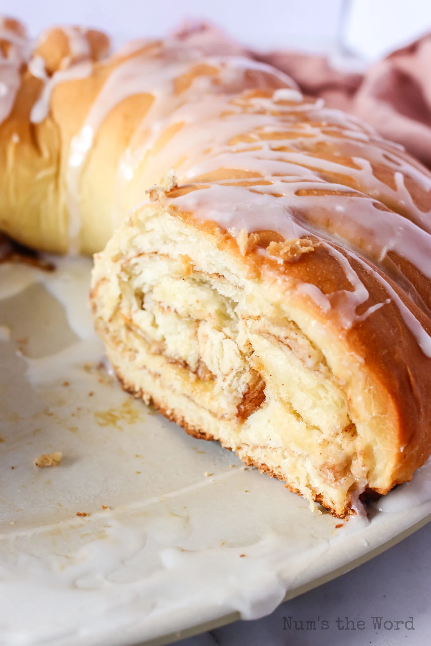 swedish tea ring with a slice removed to show swirled center