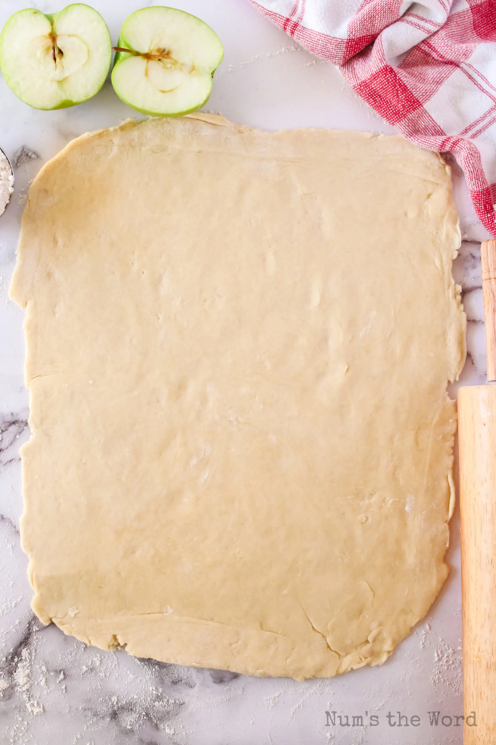 Dough rolled out on a counter