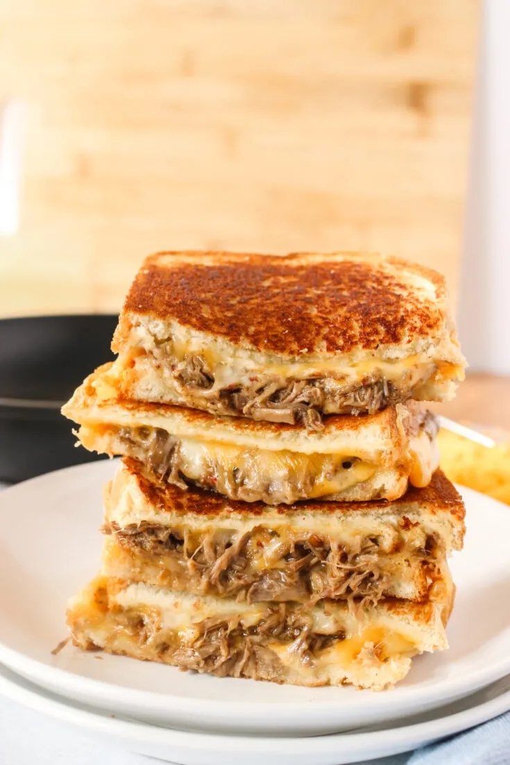 grilled cheese stacked up on top of each other facing the camera