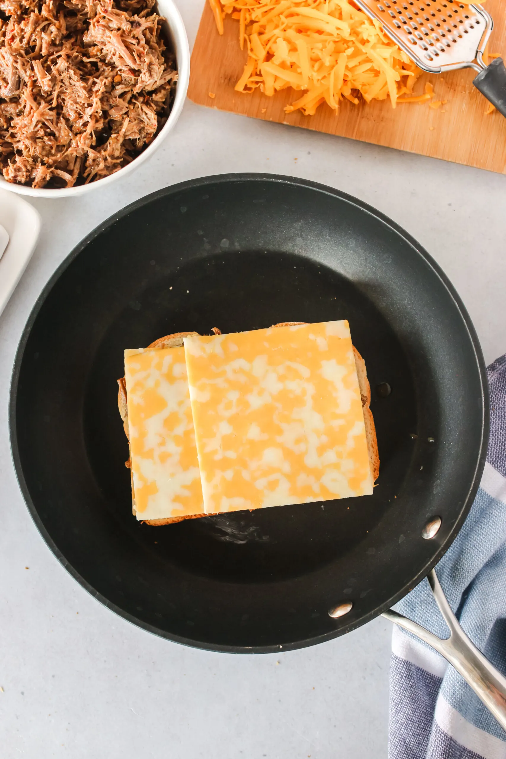 more cheese placed on top of beef